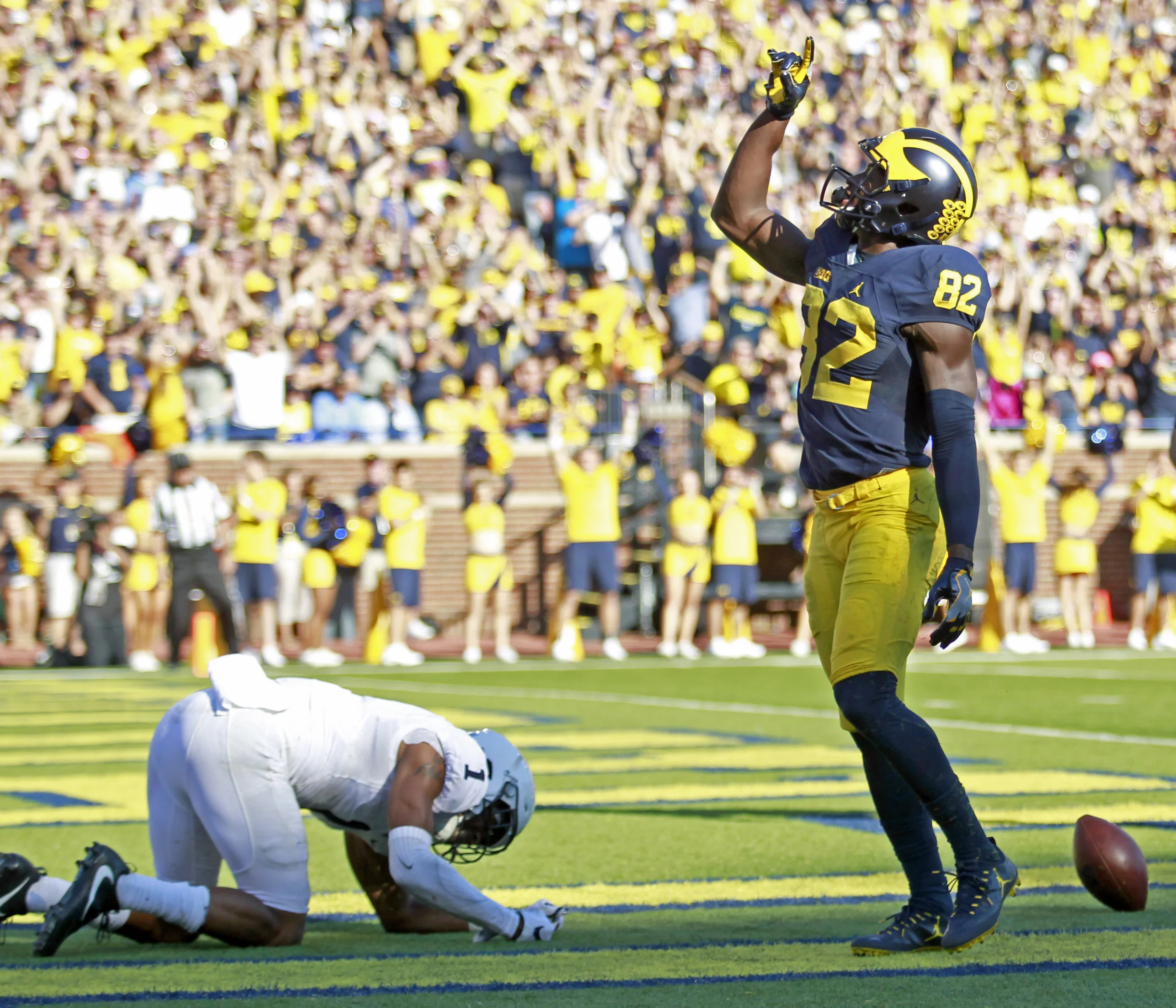  University of Michigan wide receiver Amara Darboh (82)&nbsp;celebrates as Penn State corner back Christian Campbell (1) punches in frustration the ground after completing a touchdown pass in the first half of the football game at "The Big House" in 