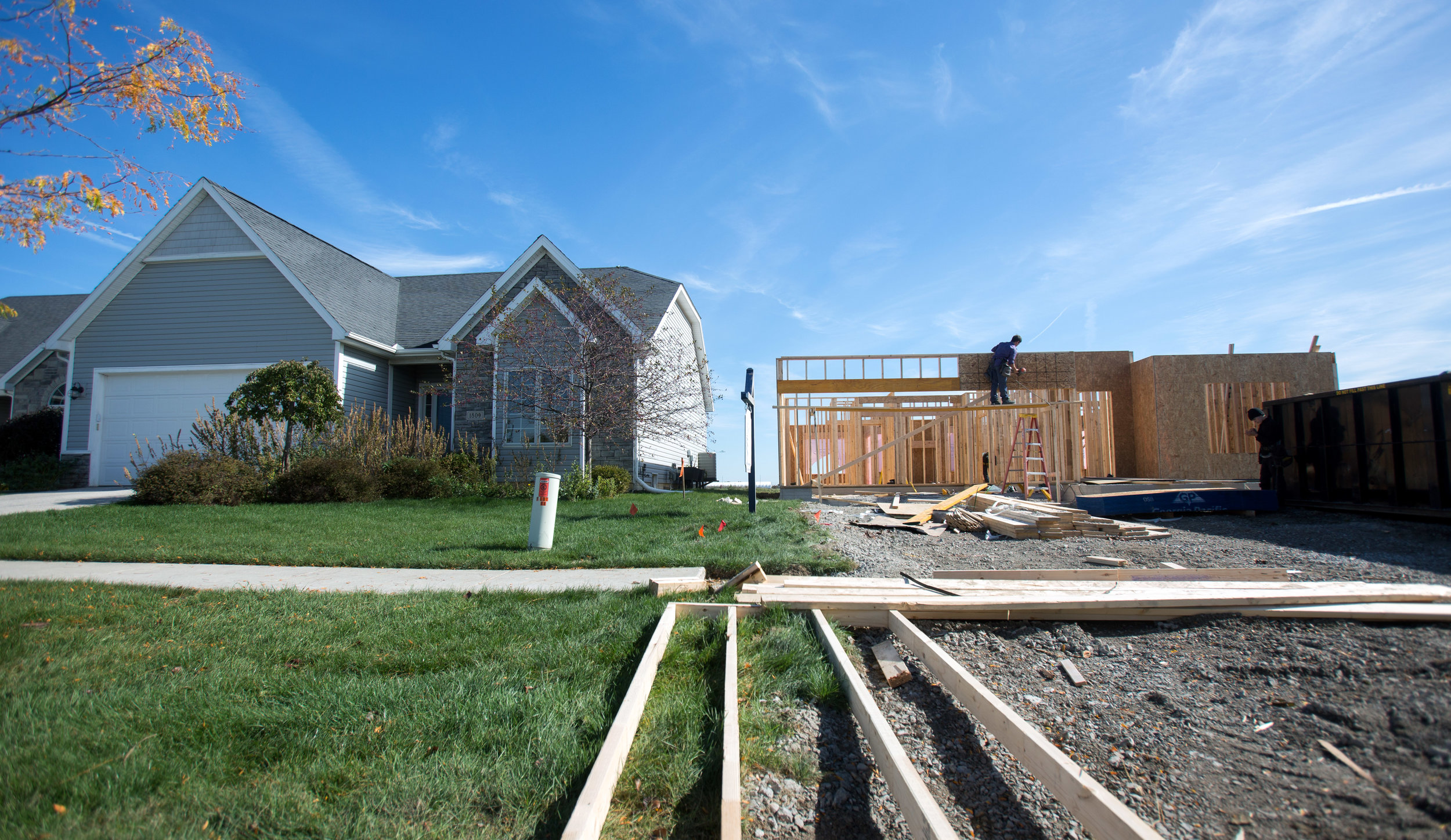 Brett Wickey of Spencerville works on the front of a house under construction in the Rivers Edge sub division on Hidden Ridge drive in Perrysburg on Tuesday, Oct. 25, 2016.