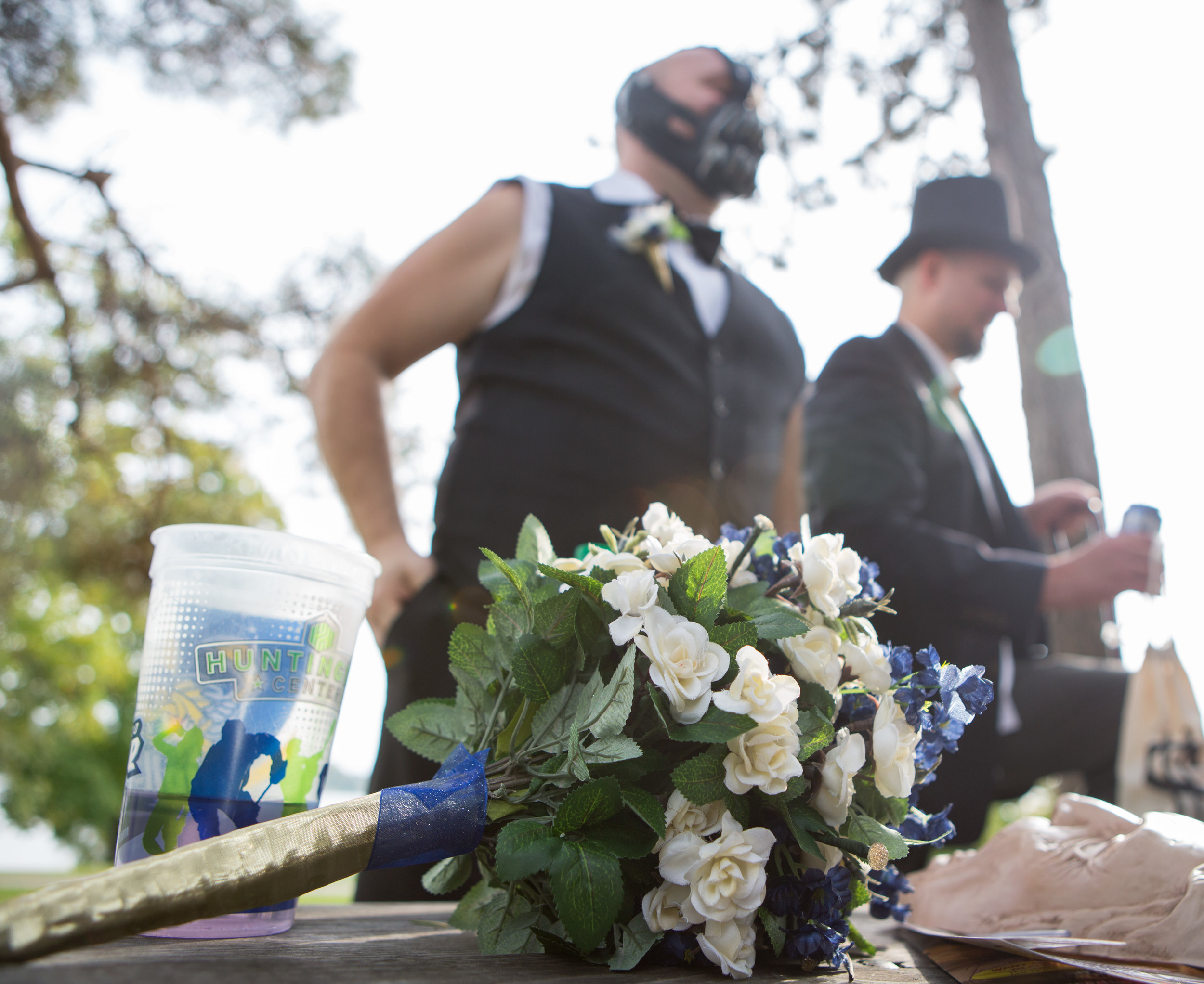 Groomsmen Steve Van Etten, left, and Mike Nowacki stand by a picnic table in Halloween costumes in Walbridge Park before participating in a wedding ceremony on Saturday, Oct. 29, 2016.