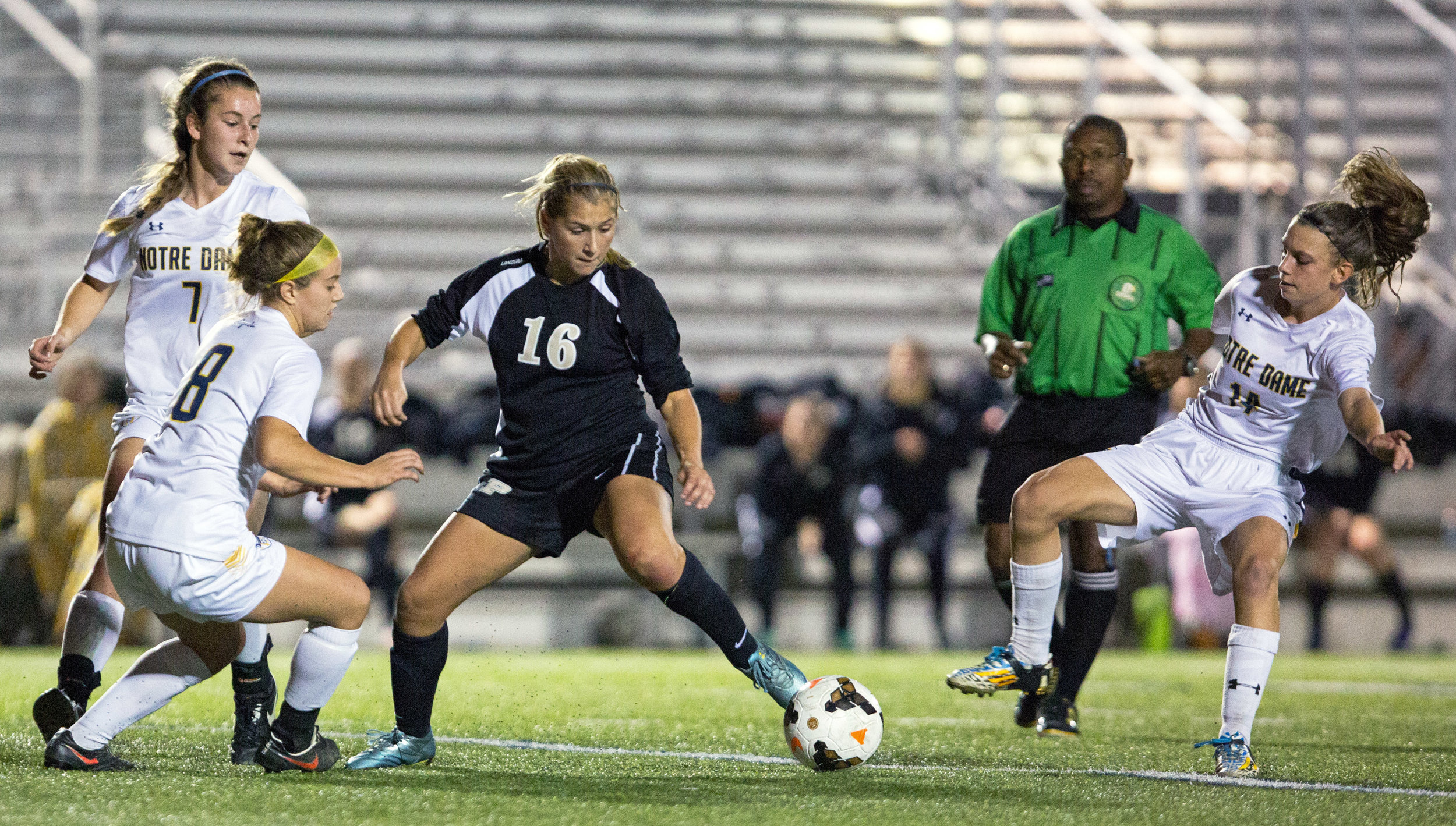  Perrysburg High School forward Anna Kirby (16) is boxed in by Notre Dame forward Casey Paluch (8), and midfielders Emily Kozak (7) and Alyssa Stark (14) during the Div. 1 regional semi-final girls soccer game at Lake High School in Millbury, Oh. on Tuesday, Nov. 1, 2016. Notre Dame won the game 3-2. 