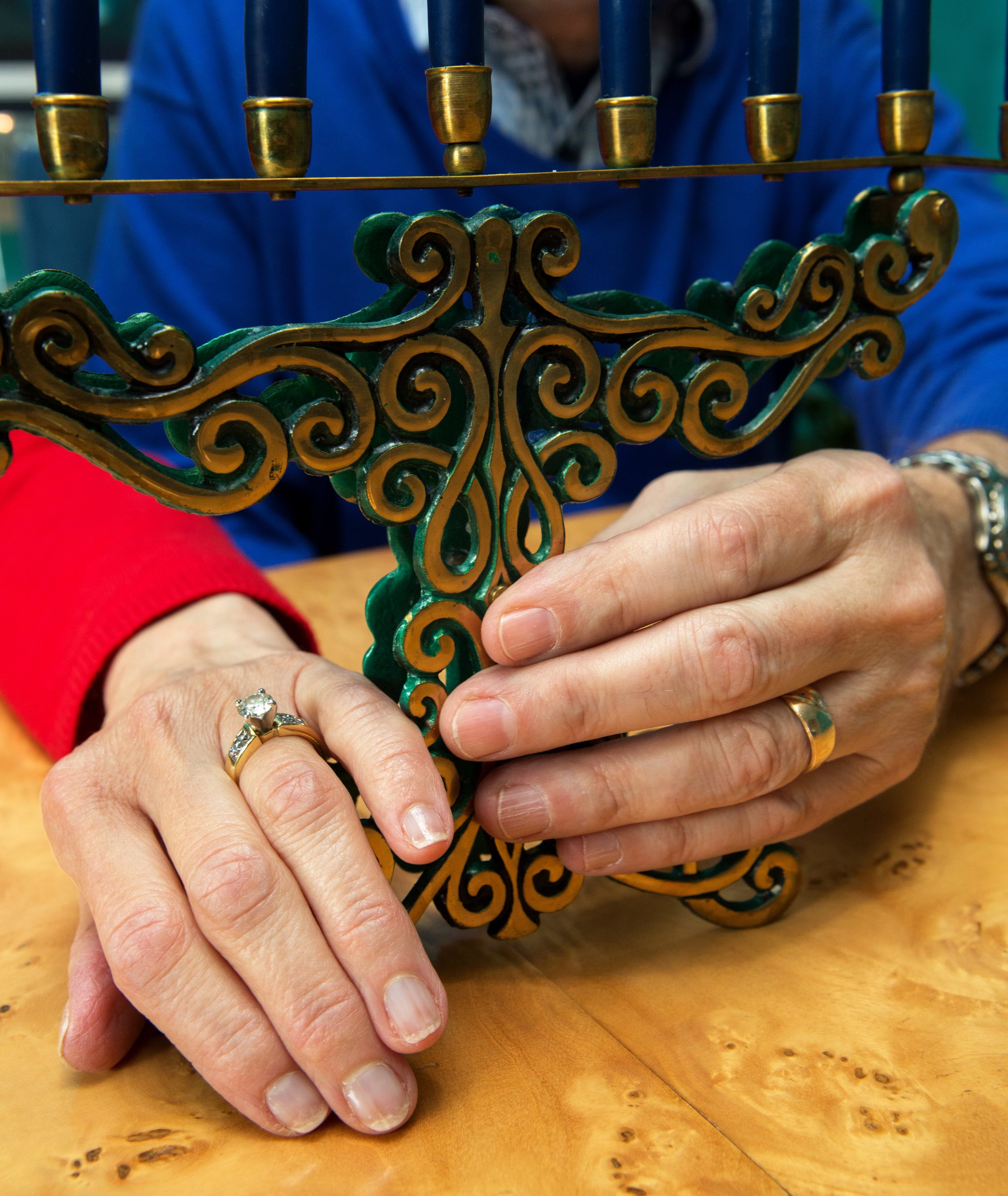 Chuck and Fran Weinblatt pose for a photograph with the menorah they received as a wedding gift 43 years ago in their home in Sylvania, Oh. on Friday, Nov. 4, 2016.