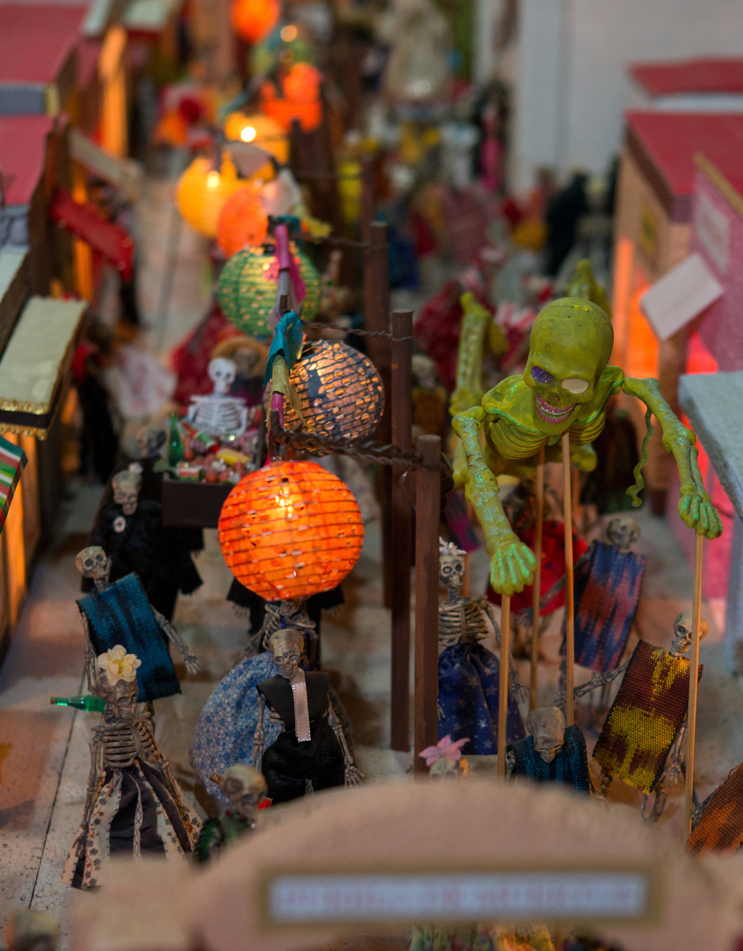 A model Day of the Dead town created by Kristen Snodglass on display in the Jose Martines Memorial Galeria during the Sofía Quintero Art and Cultural Center's 20th annual Day of the Dead celebration at on Broadway St. in Toledo on Saturday, Nov. 5, 2016. 