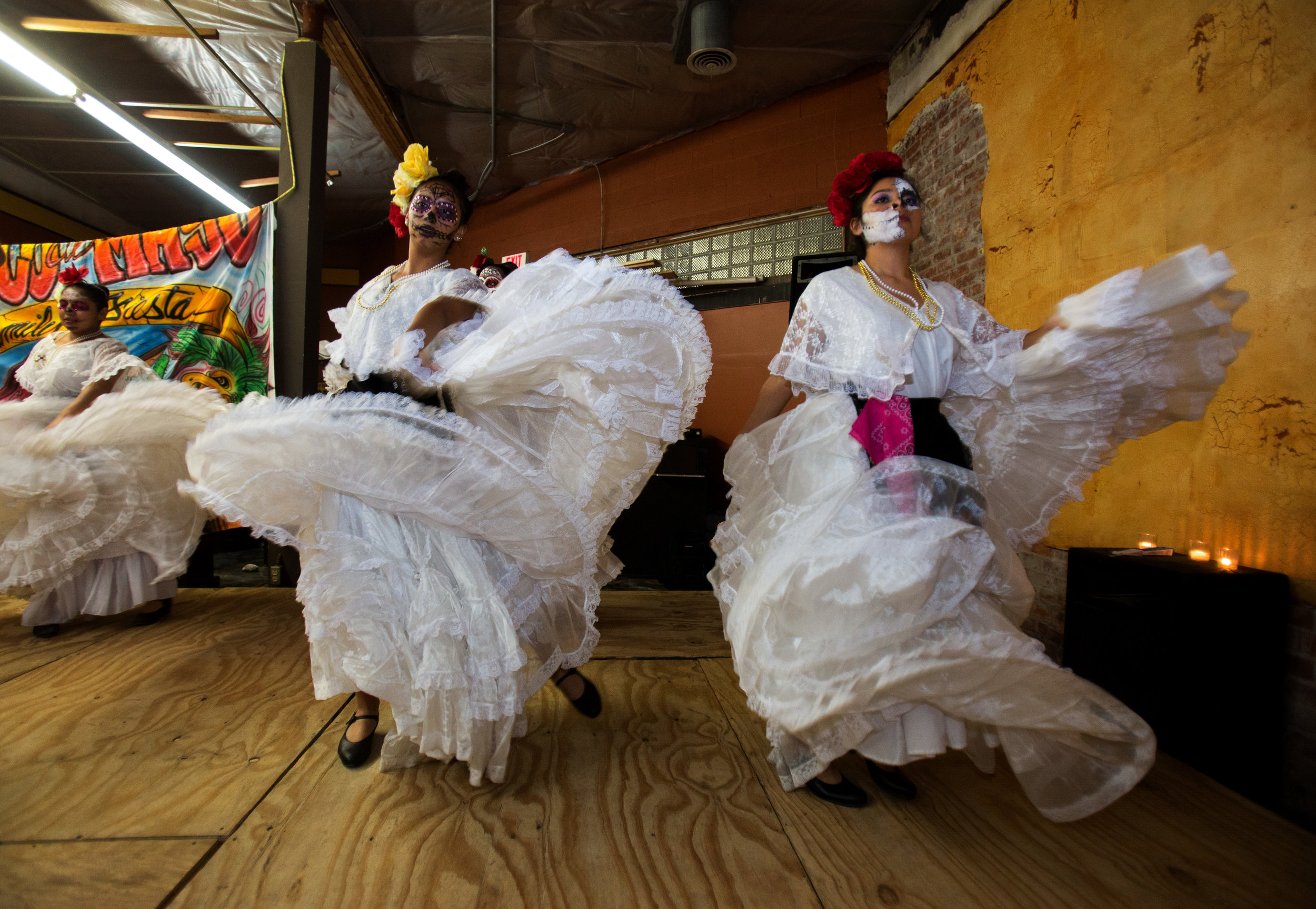 Members of the Ballet Folklorico Imagenes Mexicanas Isabel Huembes, left, and Alicia Gonzalez, dance in the Jose Martinez Memorial Galeria during the Sofía Quintero Art and Cultural Center's 20th annual Day of the Dead celebration at on Broadway St. in Toledo on Saturday, Nov. 5, 2016.