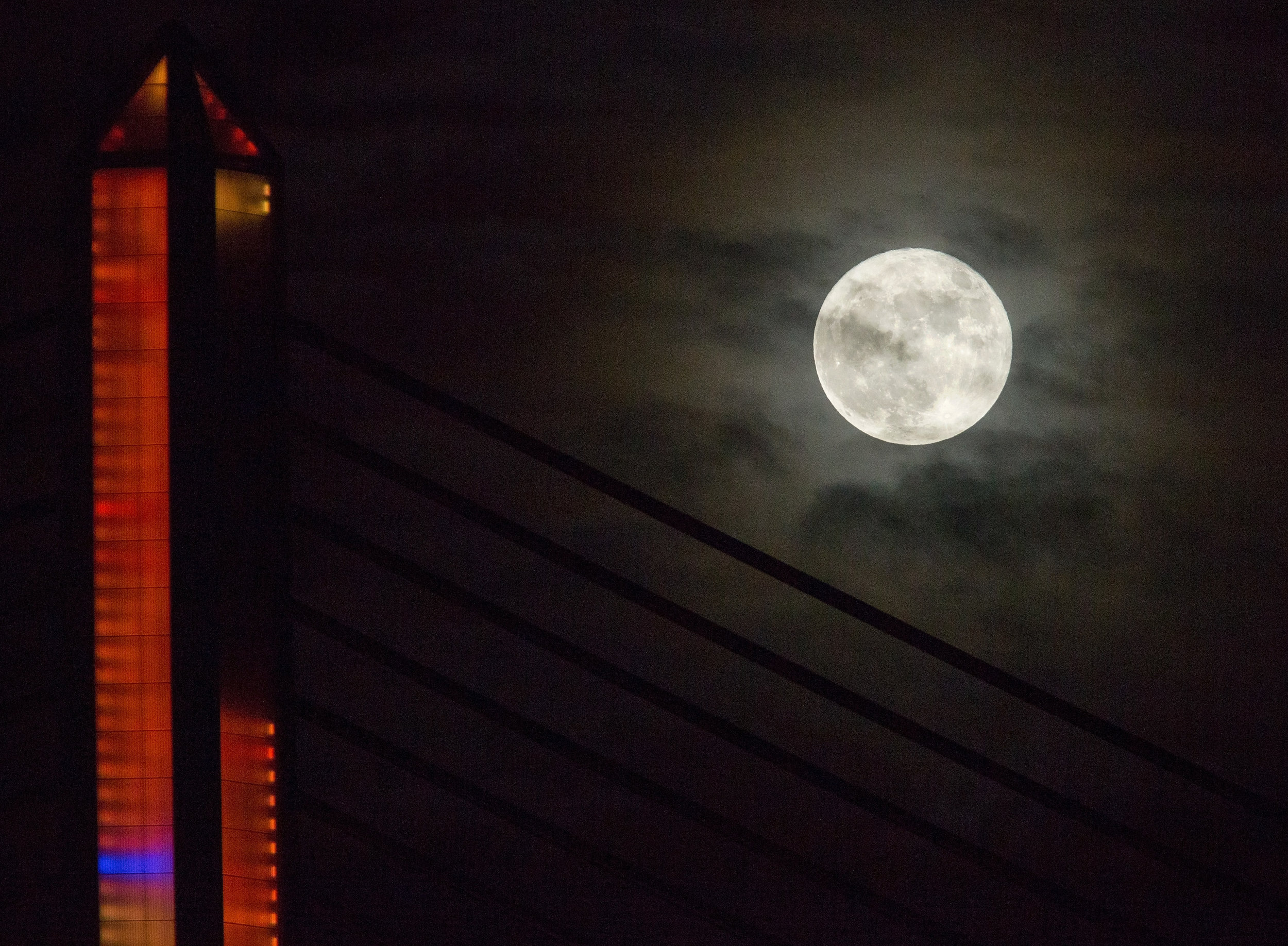 The super moon over the Veteran's Glass City Skyway Bridge in downtown Toledo photographed on Monday, Nov. 14, 2016.