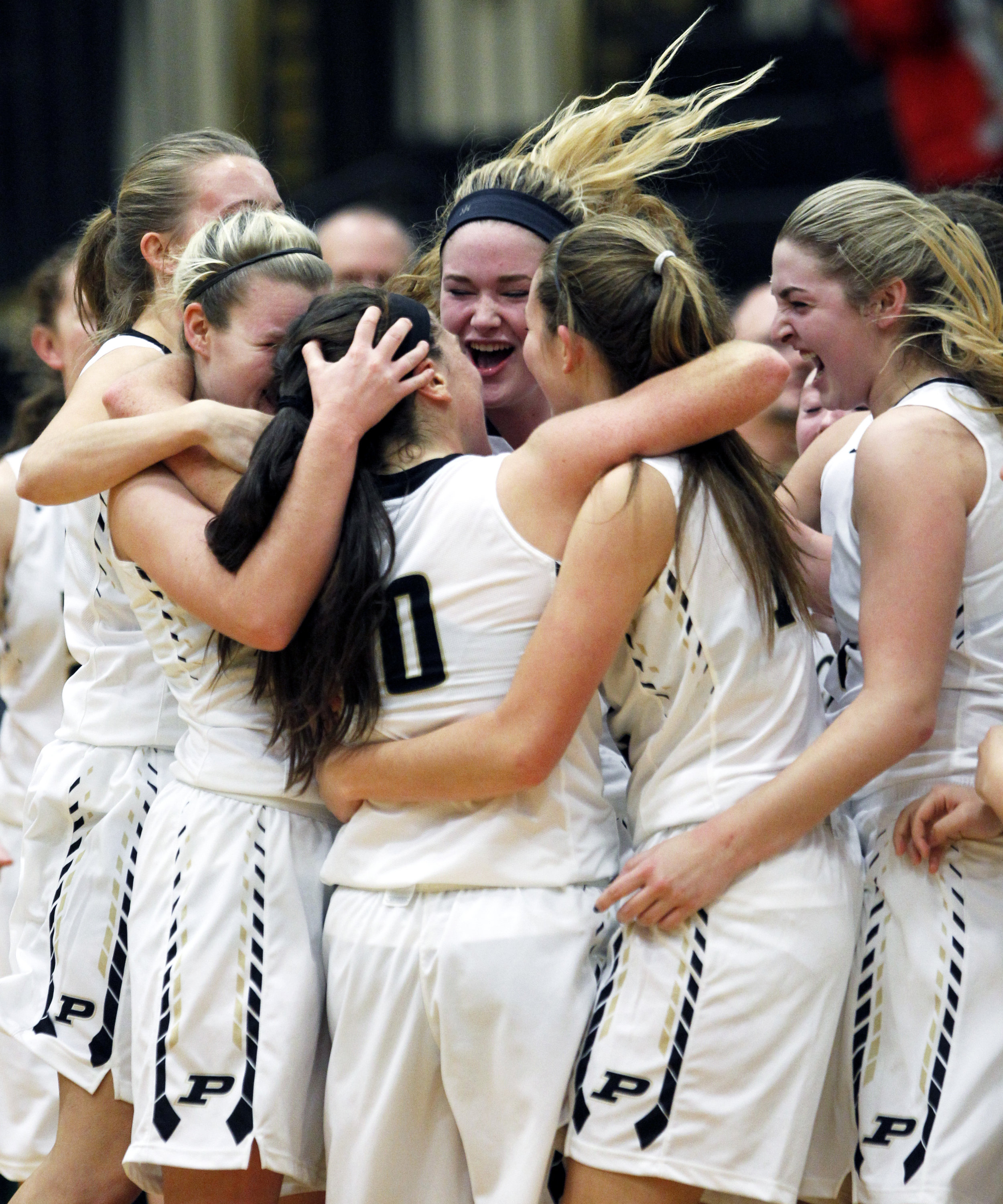  The Perrysburg High School varsity girl's basketball team celebrates the 3-point basket scored by guard Kristina DeMarco (10) at the buzzer sending the girl's varsity basketball game against Sylvania Northview High School into it's first overtime at Perrysburg High School on Thursday, Dec. 8, 2016. Perrysburg won the game double overtime 58-53. 