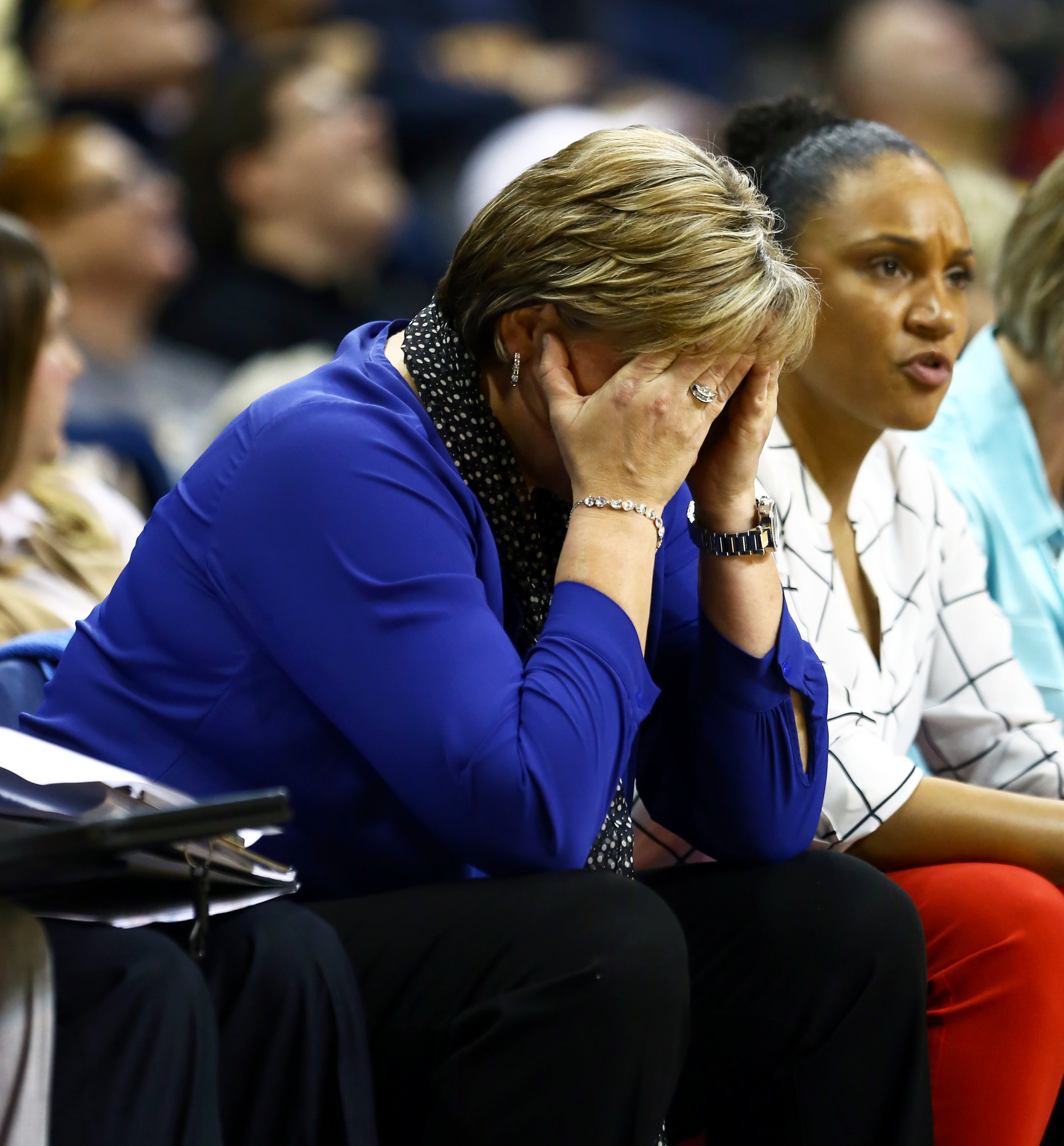 University of Toledo women's basketball head coach Tricia Cullop holds her head in her hands on the bench after a turn over to Notre Dame during the women's basketball game at Savage Arena on the University of Toledo's campus on Sunday, Dec. 18, 2016. Notre Dame won the game 85-68.