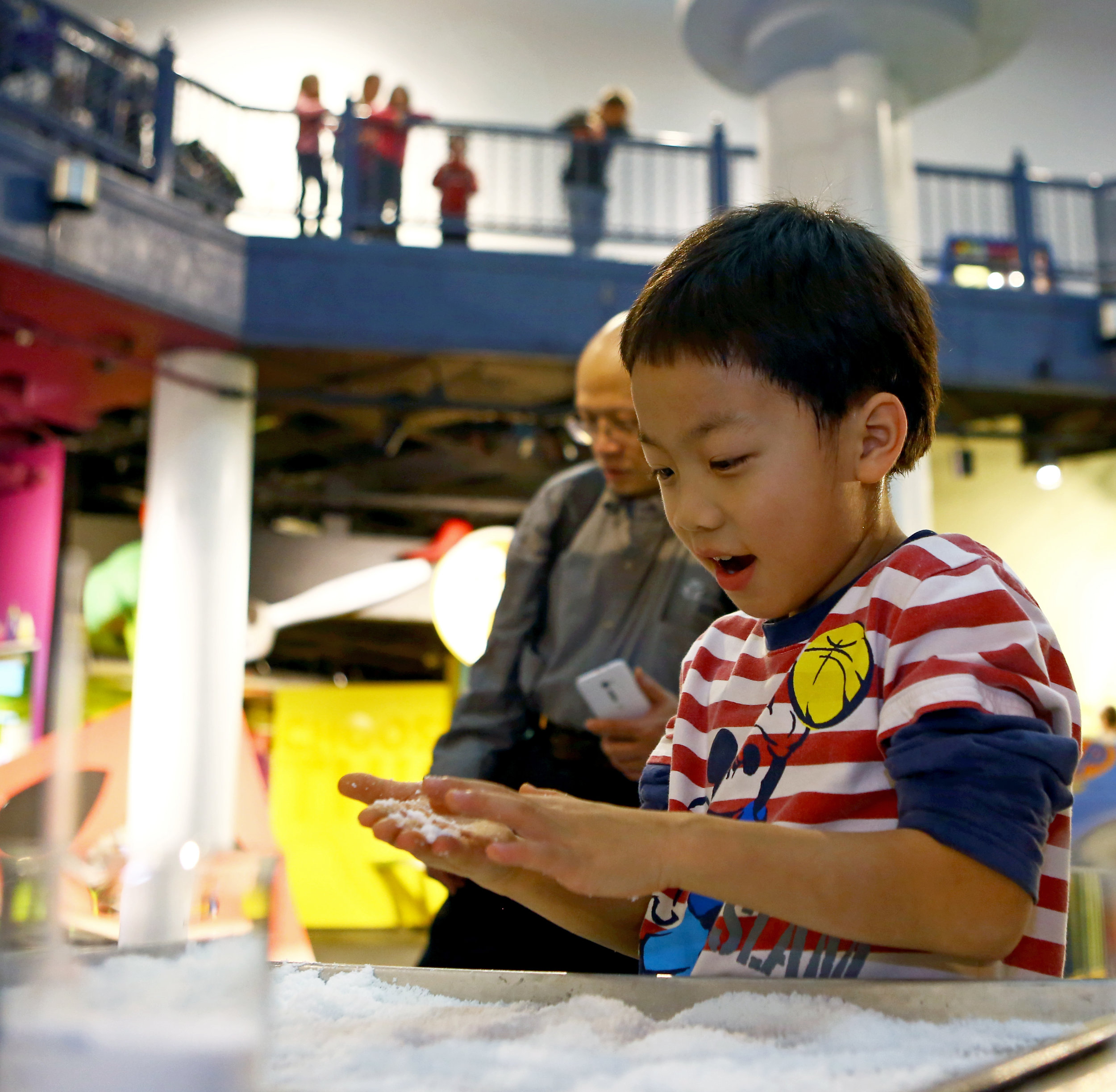 Neil Huang, 8, of Findlay plays with the "insta-snow" at the annual Frostology exhibit put on by the Imagination Station in downtown Toledo, Oh. on Monday, Dec. 26, 2016. The Frostology exhibit explores the science behind snow using demonstrations and activities.