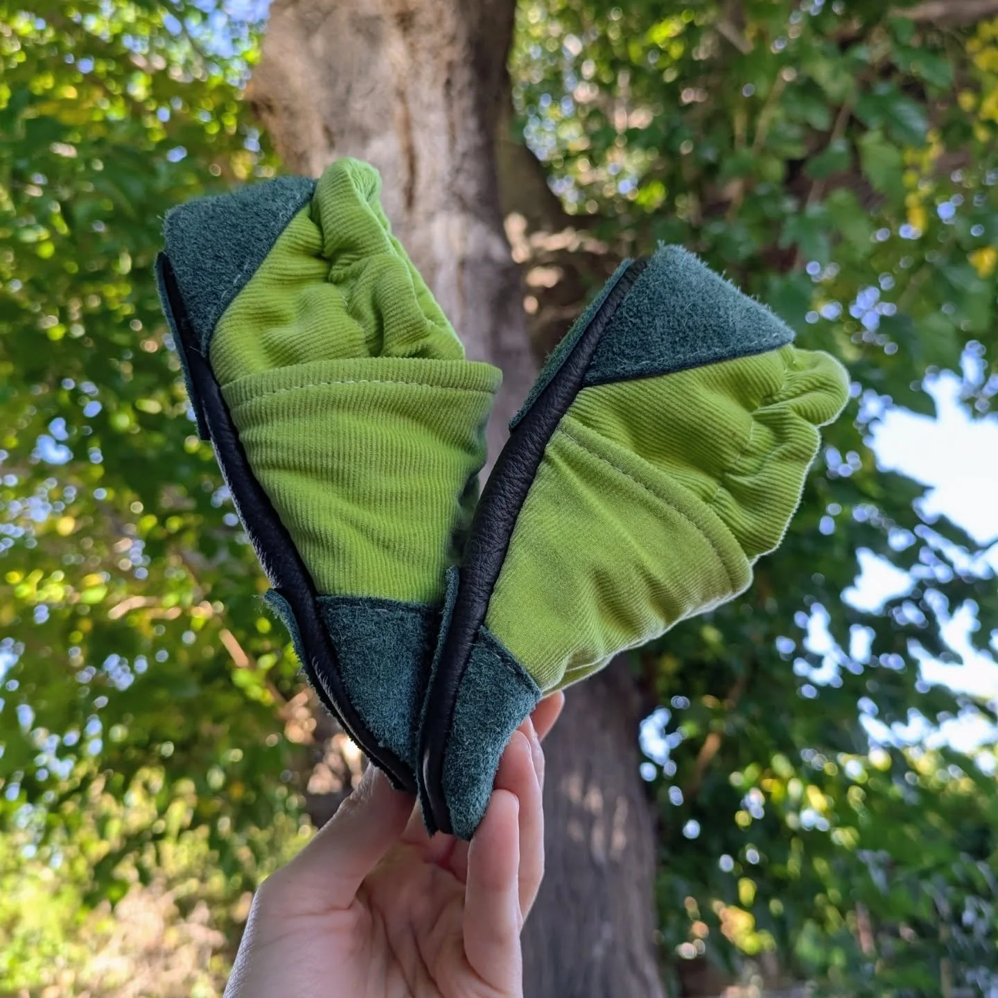 Hello, it's Tabatha, wearing small shoes on my hands. You can find the collection of handmade shoes under the Velocitoddler Redux project section in my web studio, or under the Handmade Shoes and Slippers tab in the web shop. I'll be adding new pairs