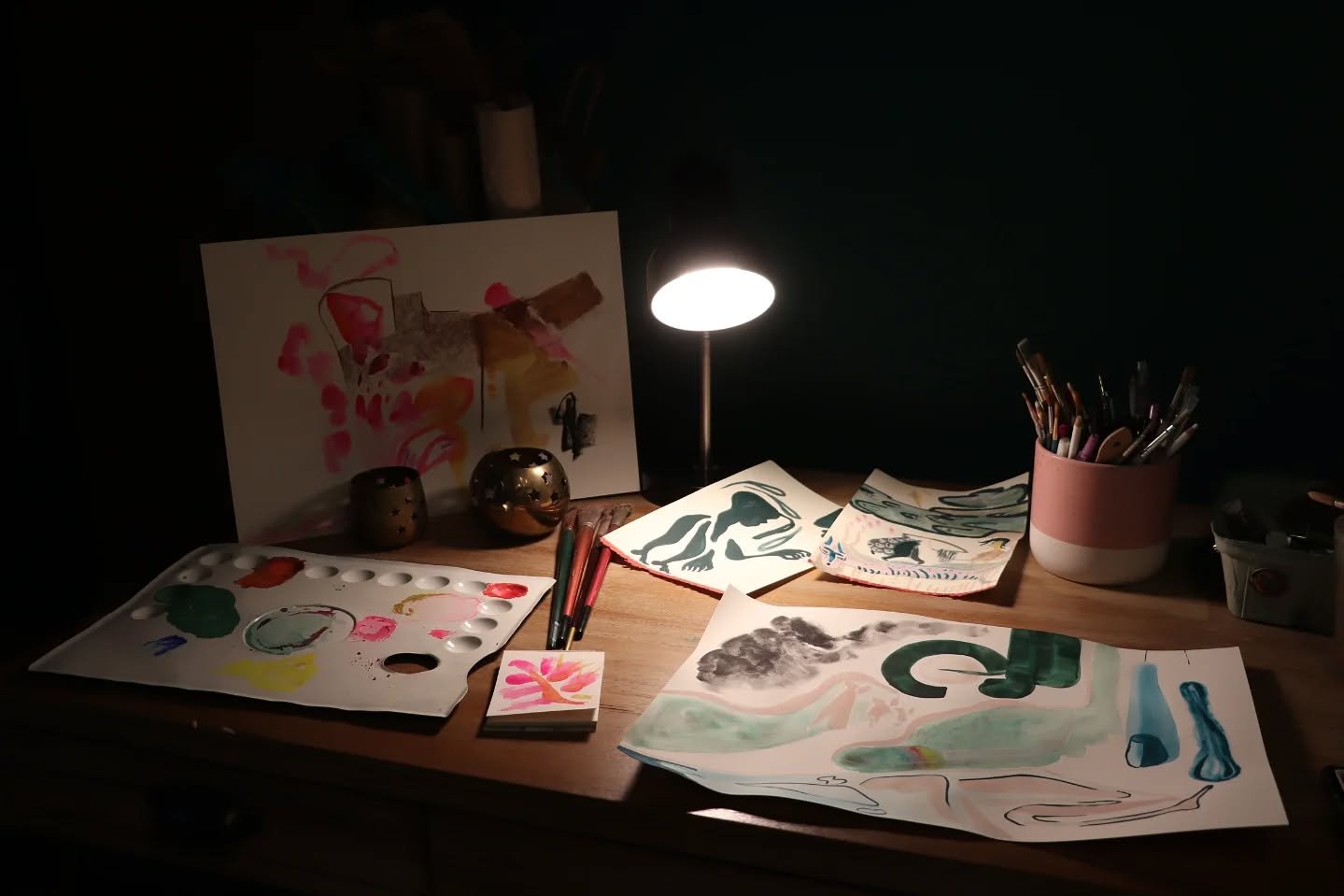 My desk today. These are scenes from my mind, memories I have that I can't point to as being from this lifetime: people traveling, looking up at the sky, out at rolling hills and the sea and the desert--the sea and the desert close to each other, san