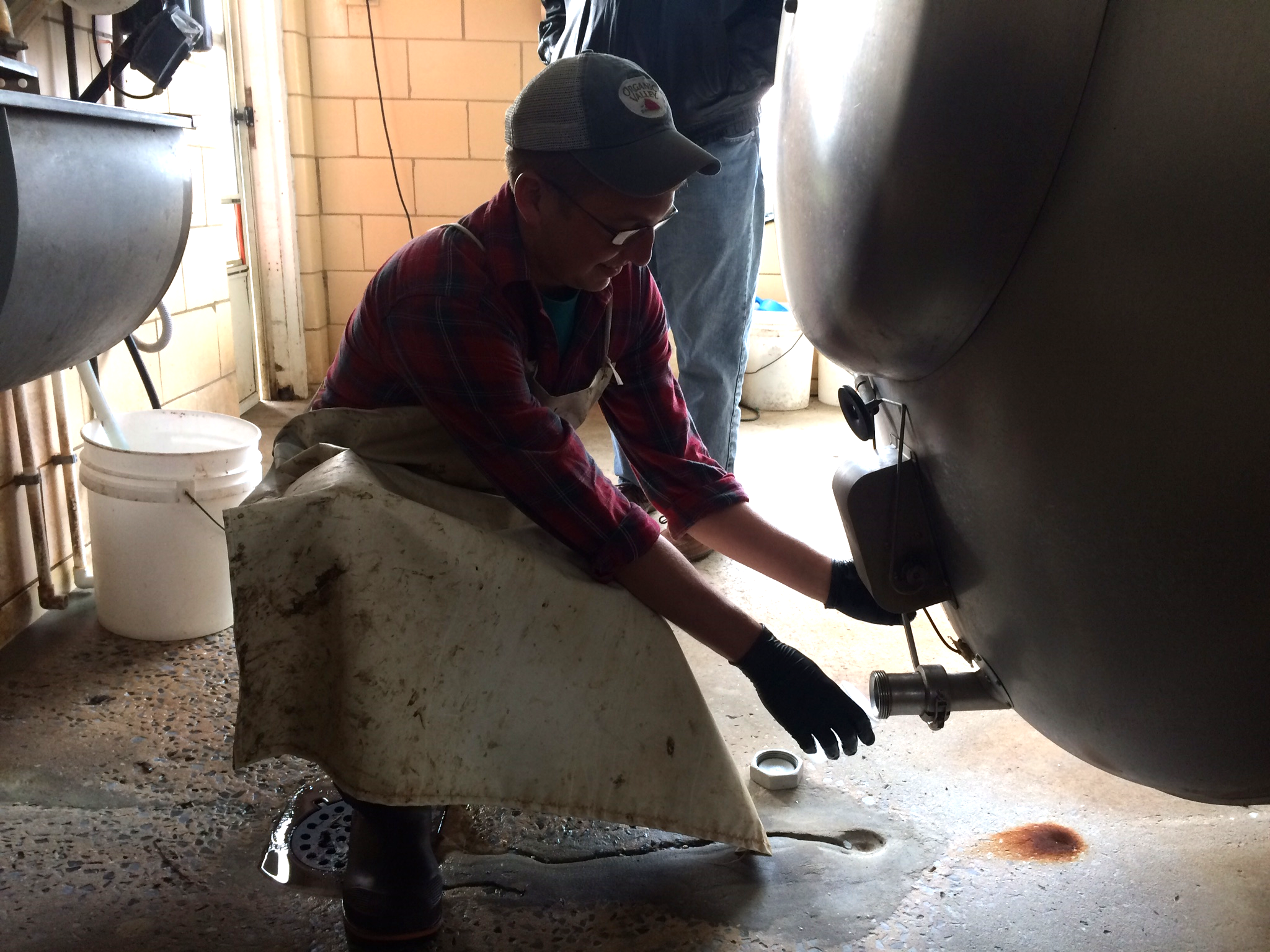 Farmer Adam Holter pours a fresh-to-death glass of milk produced directly from his cows at Holterholm Farms.