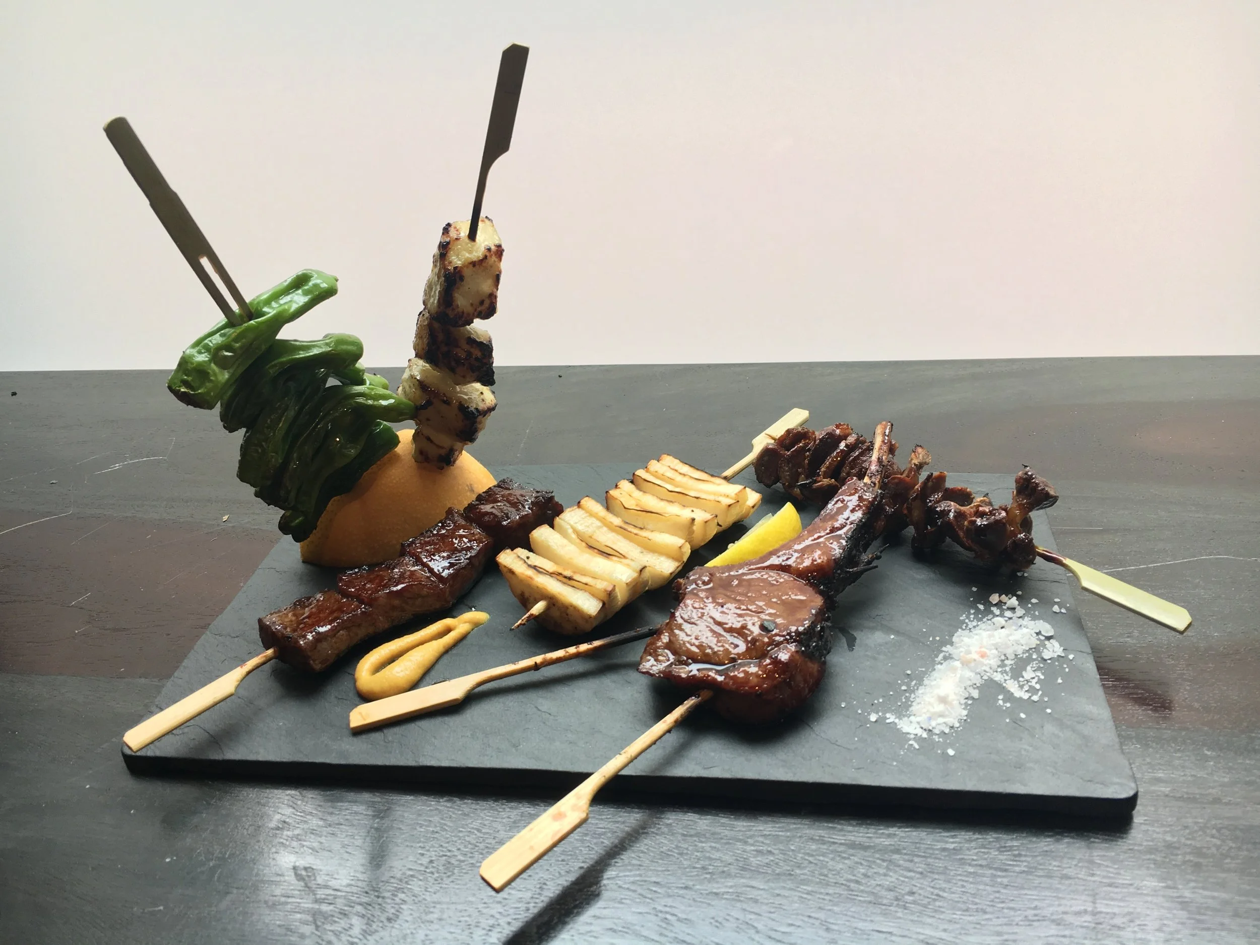 From left: Shishito peppers, Sea Bass, Wagyu Beef, King Oyster Mushroom, Lamb Chop, Chicken Gizzard