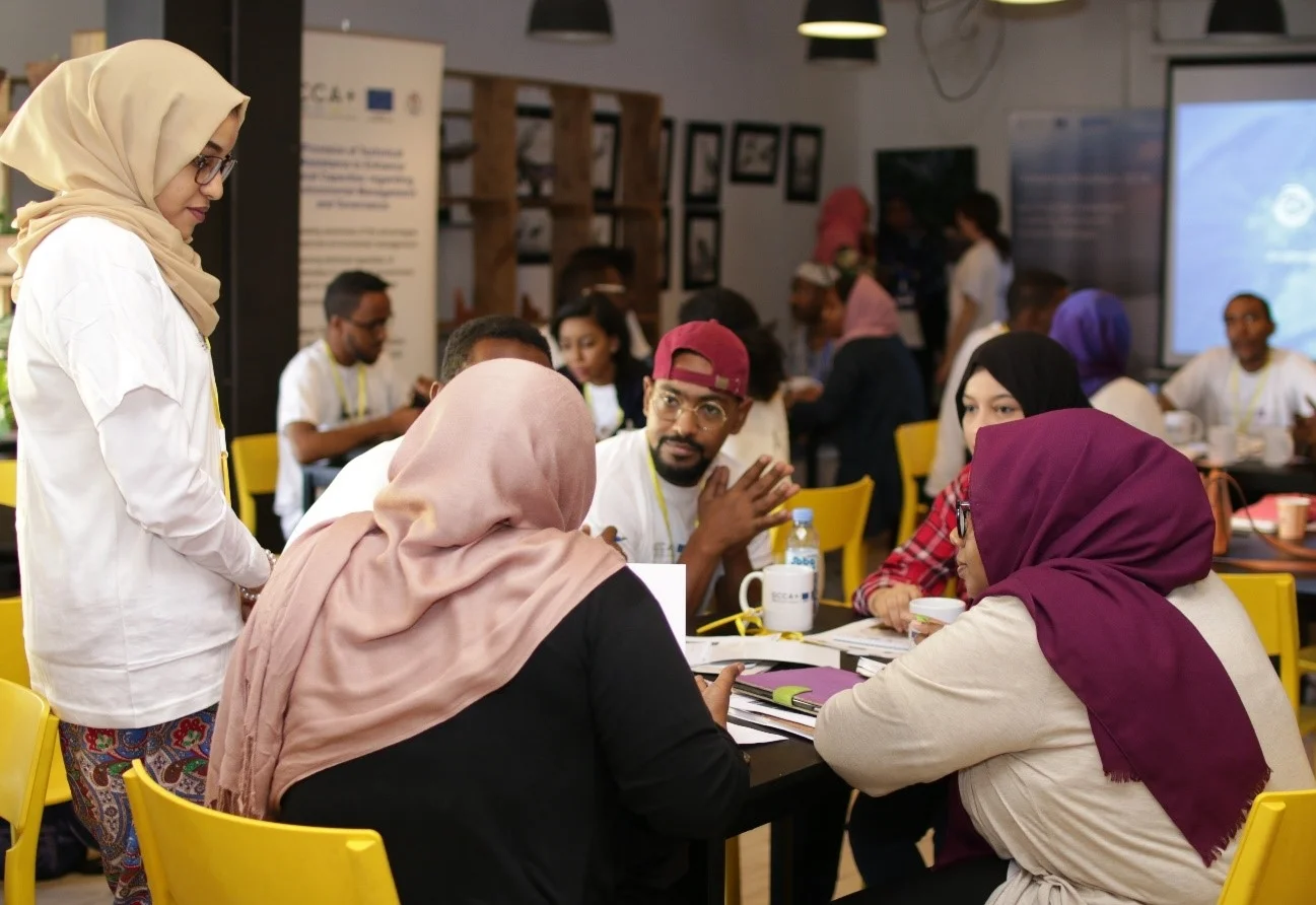 Participants working on their innovative solutions to climate challenges. Photo by Daftar Studios