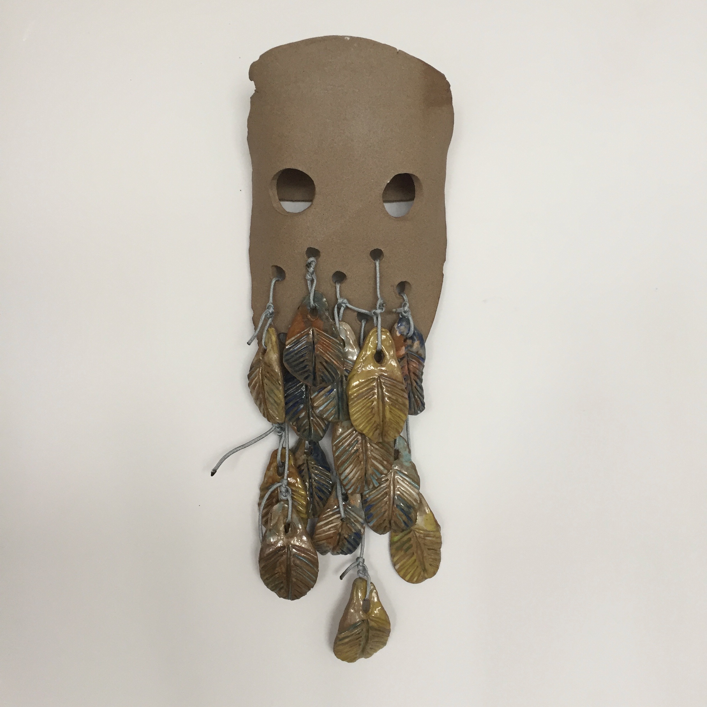 The Thing with Feathers (after Emily Dickinson), 2018, glazed and unglazed ceramic, rope, 24 x 9 x 4 inches