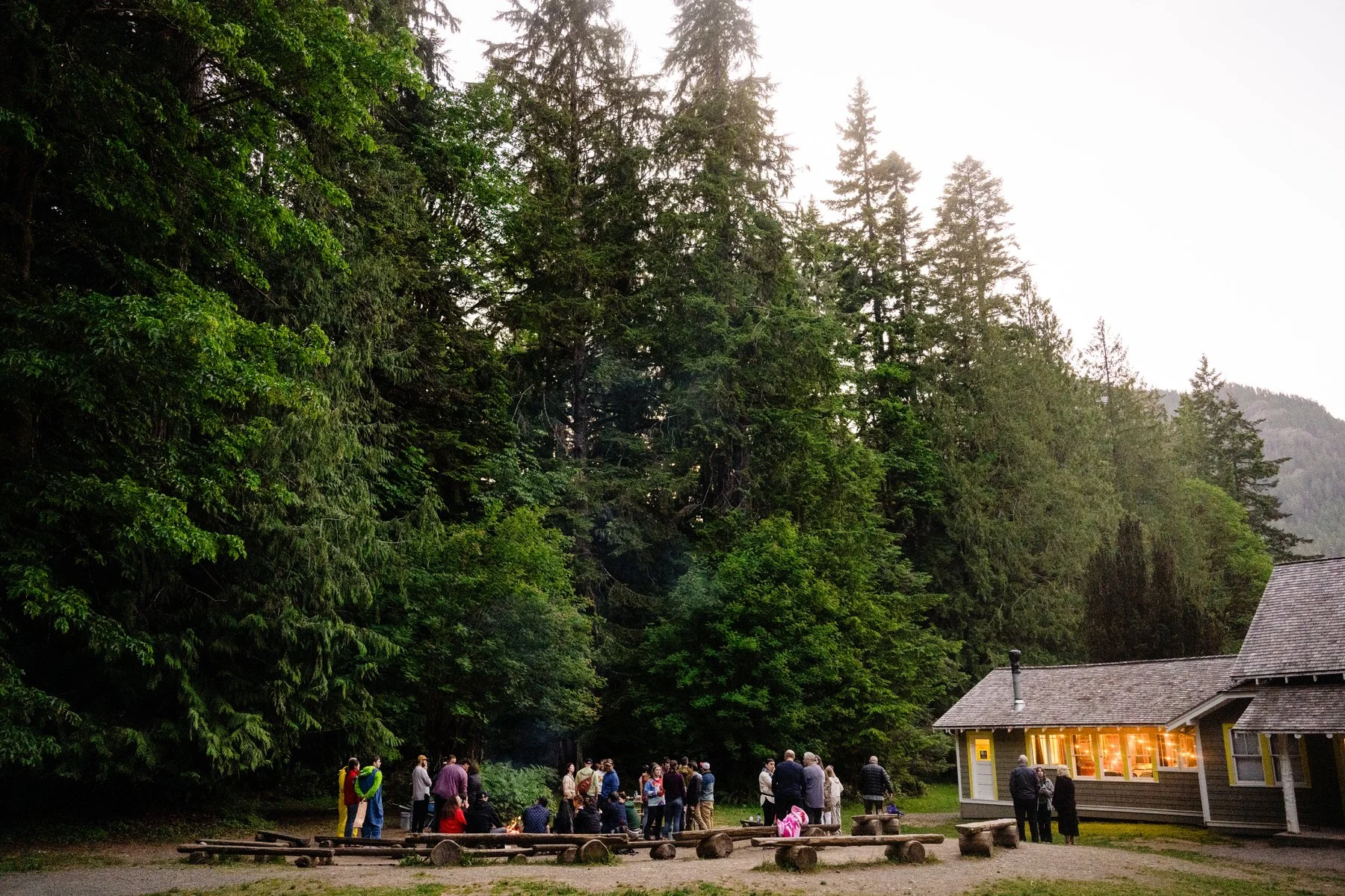 a firepit sourrounded by a group of people at a wedding