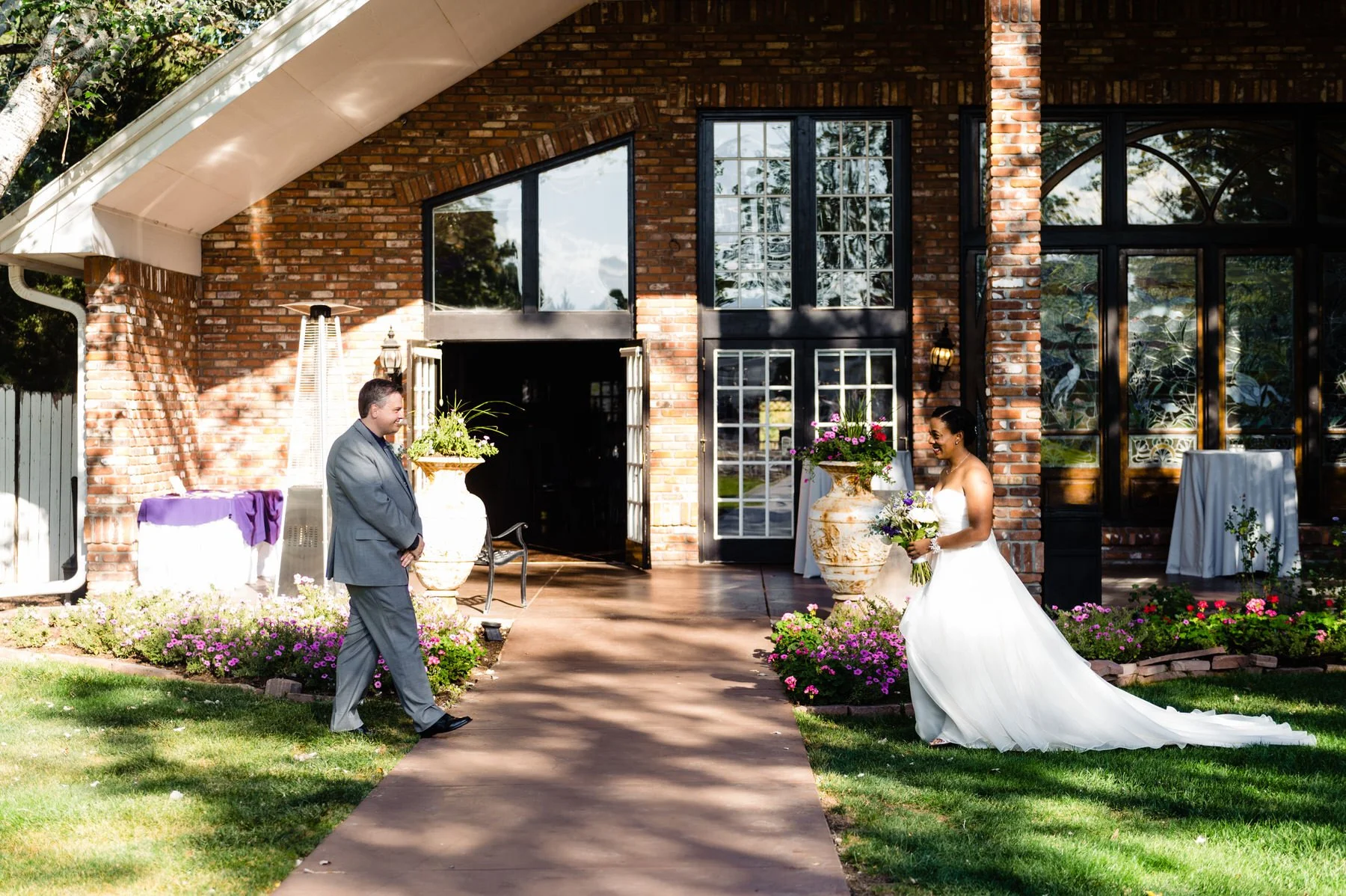 bride and groom walk to each other at their wedding ceremony at Lionsgate Event Center