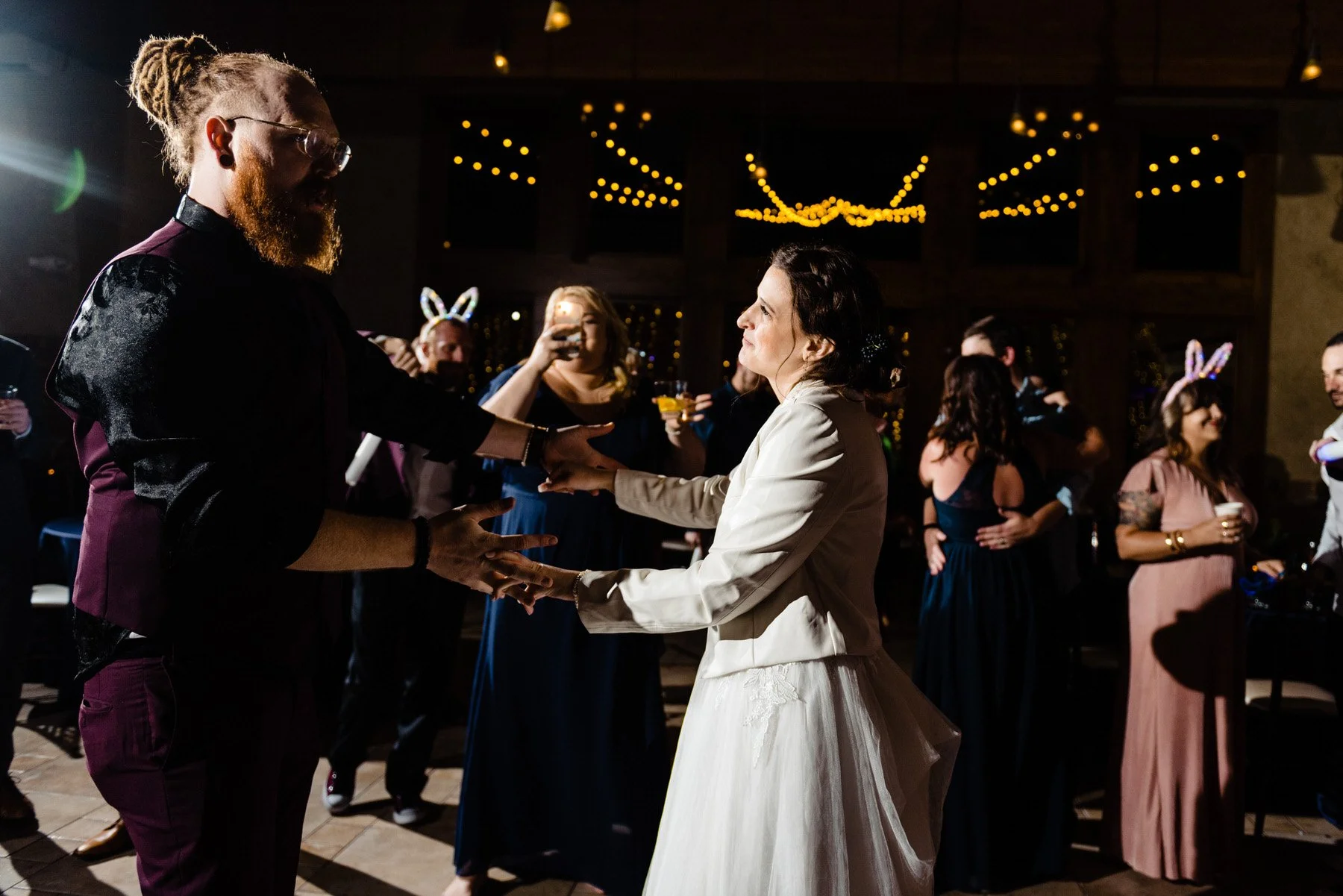 a bride and groom dance during their wedding reception