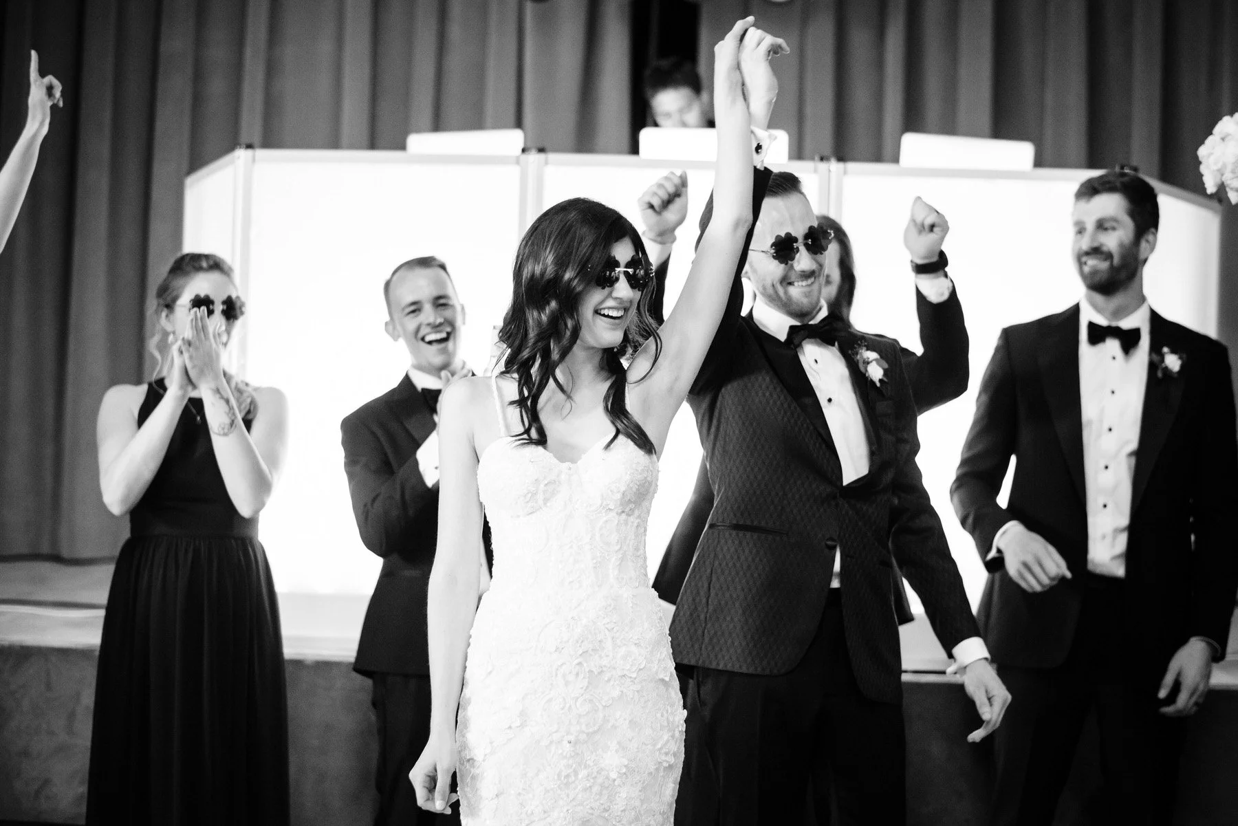 bride and groom celebrate when walking into their wedding reception at the Denver Botanic Gardens