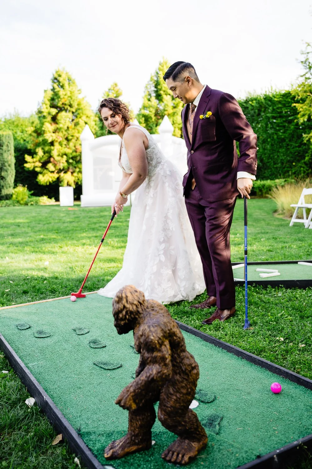 bride and groom play golf during a colorado wedding