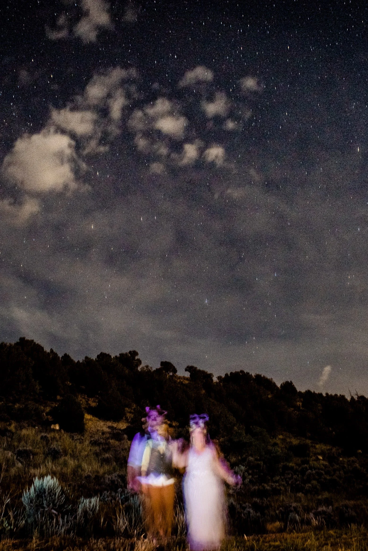 bride and groom hang out under the stars at their colorado wedding