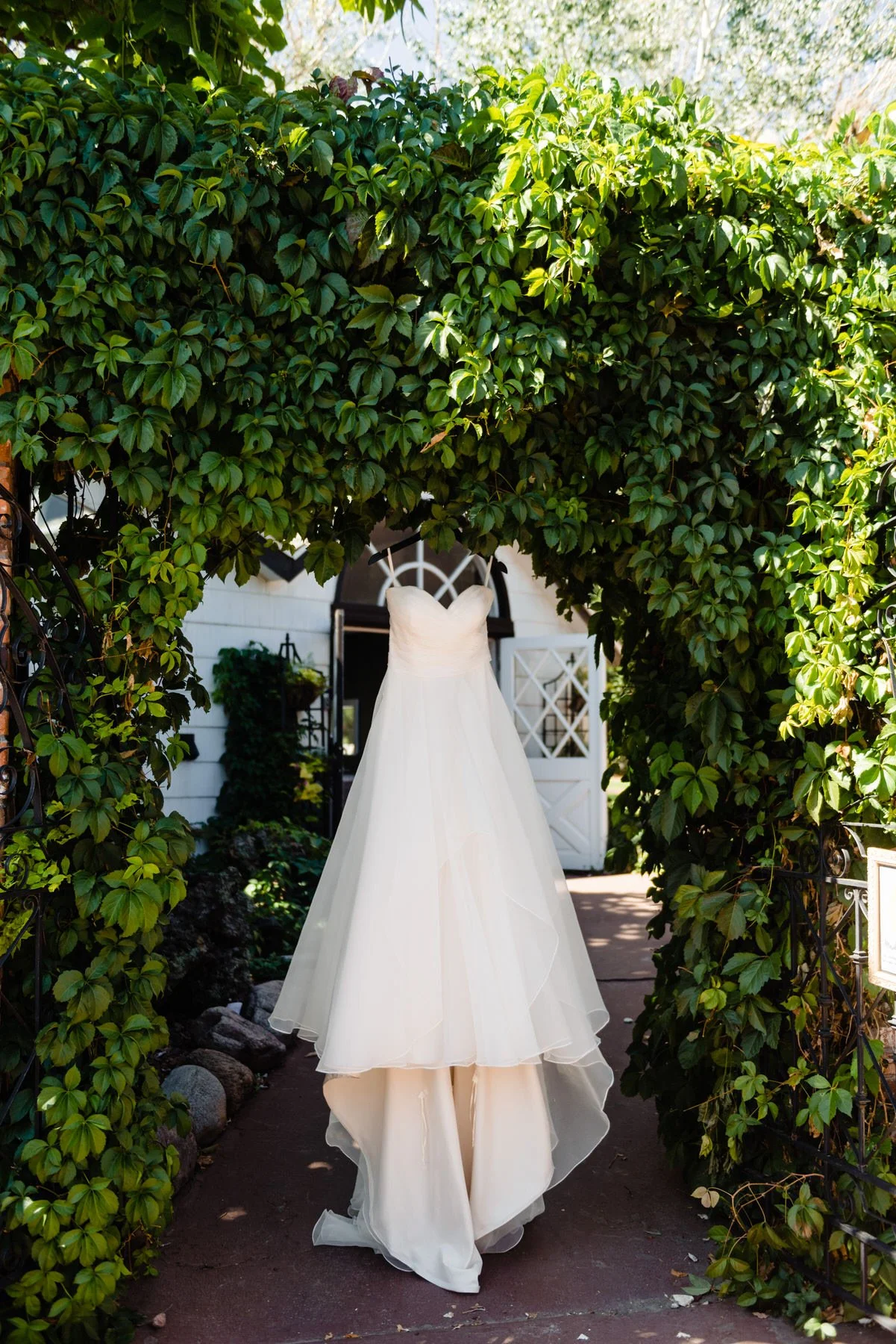a dress hangs in front of the Lionsgate Event Center