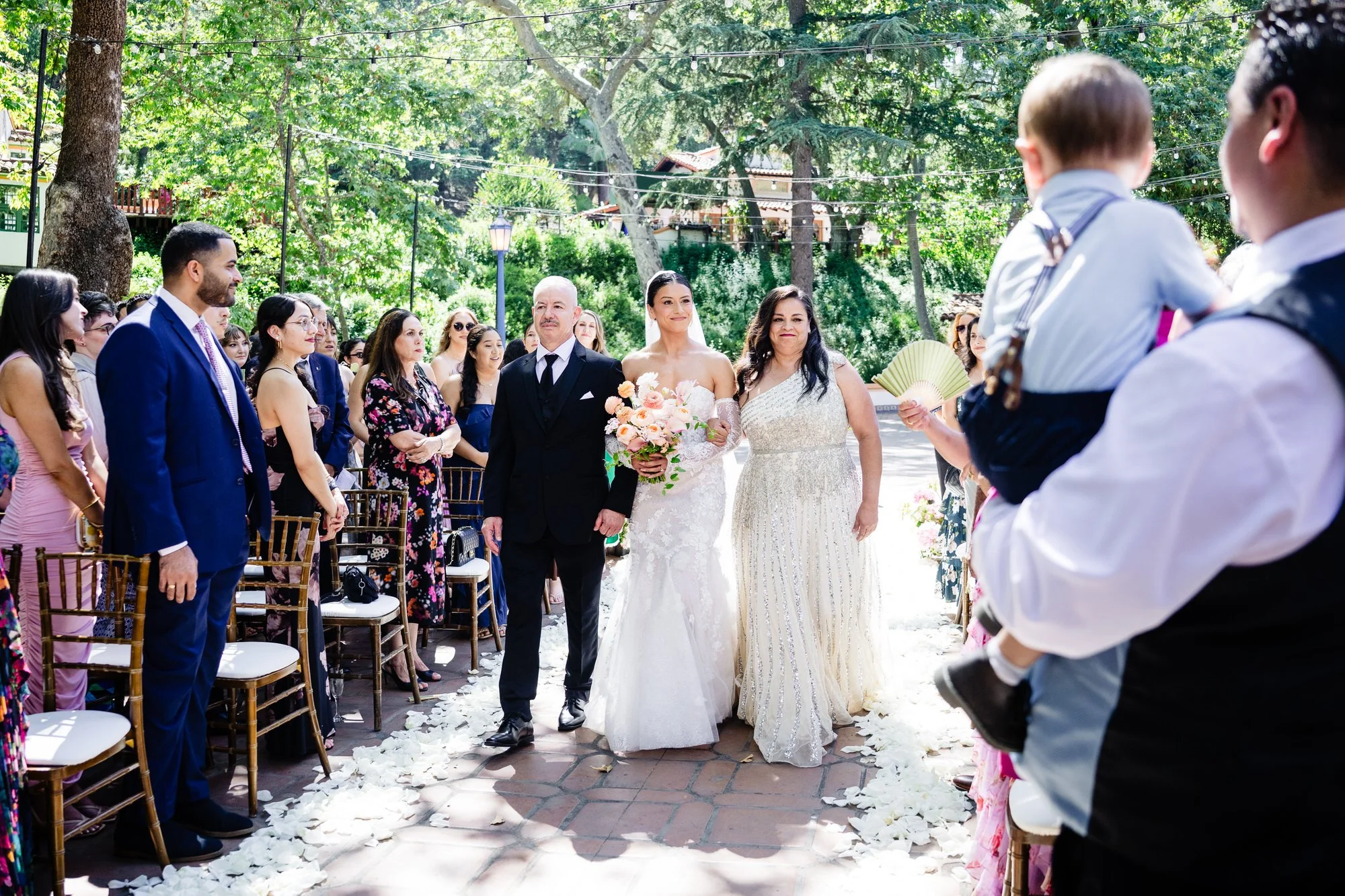 bride walks down the aisle during her Colorado wedding