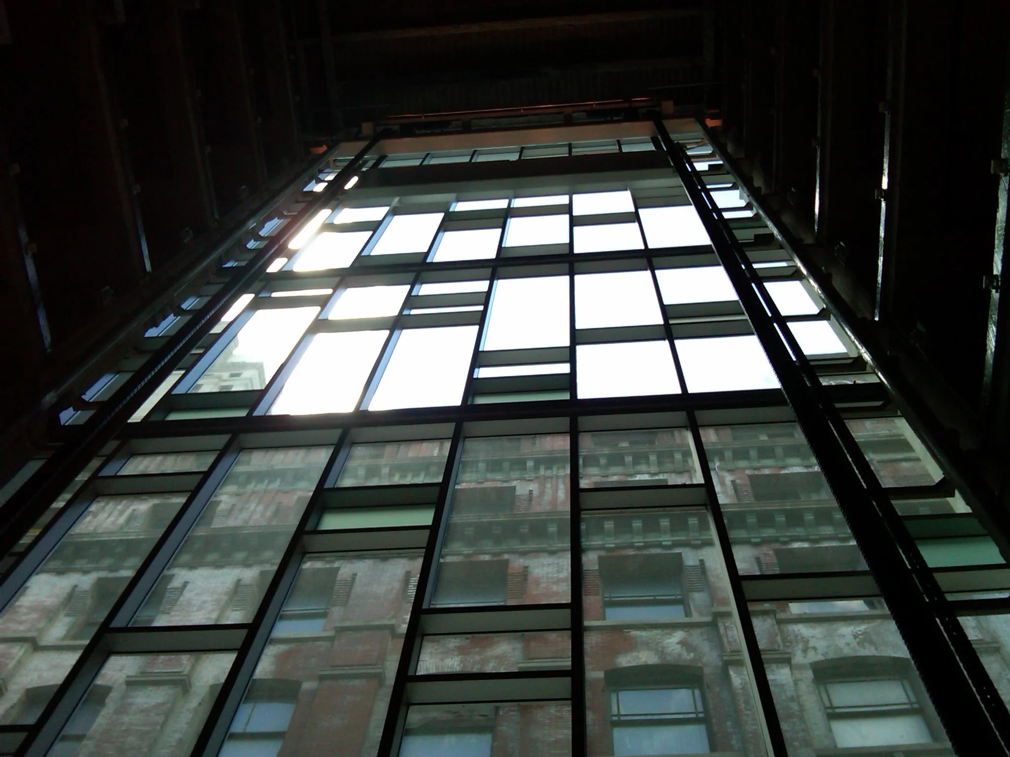 Glass wall inside hoistway 