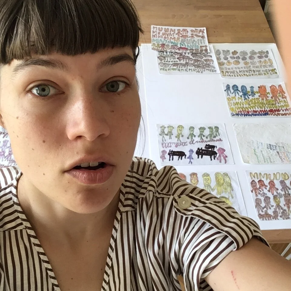 preparing Mary's art to be framed for a show.JPG