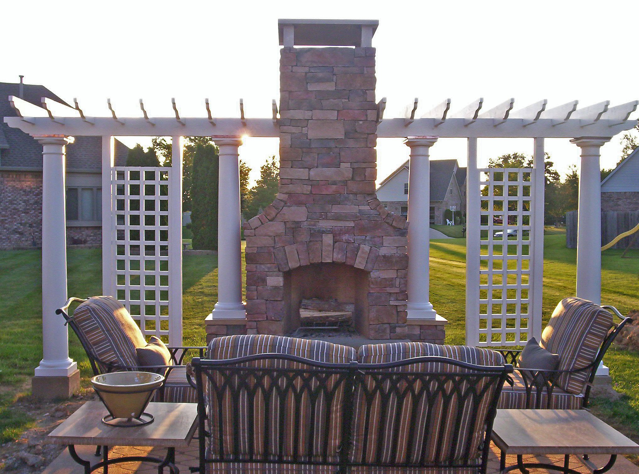 Custom Pergola with privacy screens and match outdoor fireplace