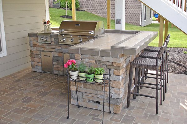 Custom Outdoor Kitchen Island with Side Burner and Additional Seating