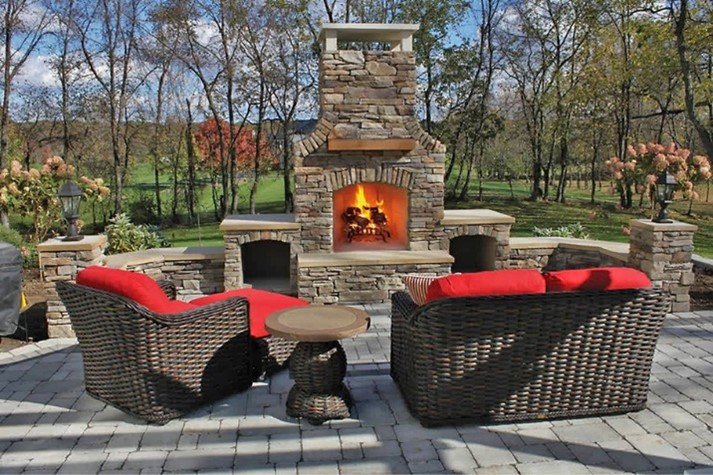 Outdoor Fireplace with wood boxes and bench seating