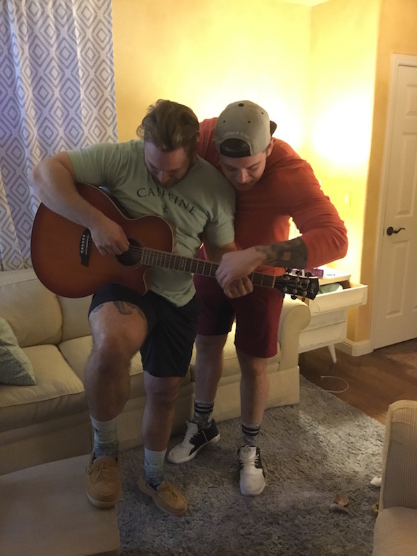 Wes kitts and sam duval playing guitar together.