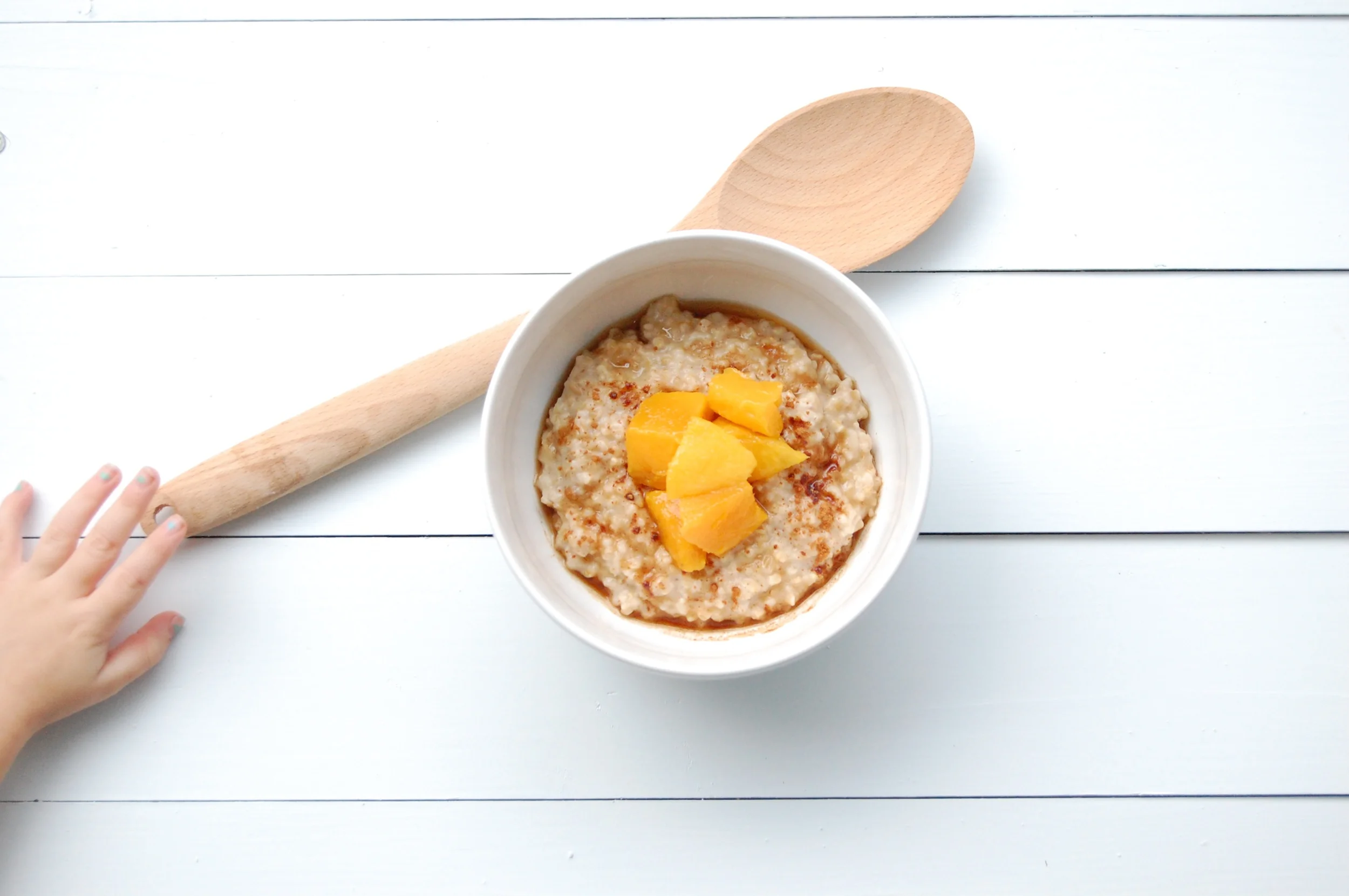 Maple-Cinnamon Oatmeal Topped with Fresh Fruit Chunks