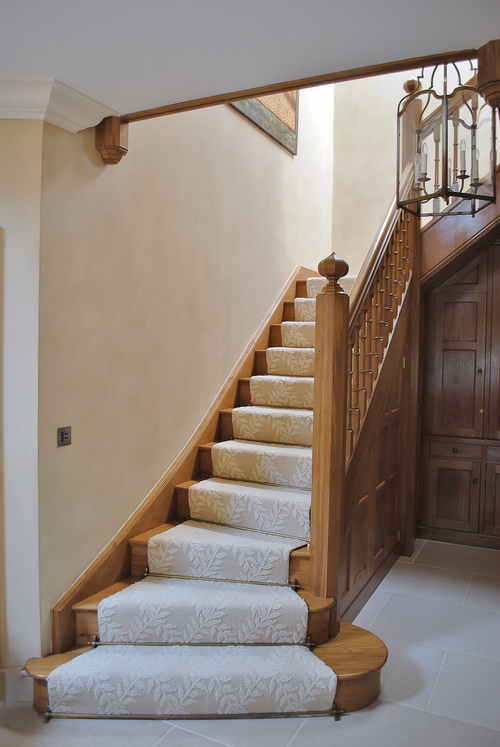 Oak Staircase with Tudor inspired shapes and under stair panelled cupboard