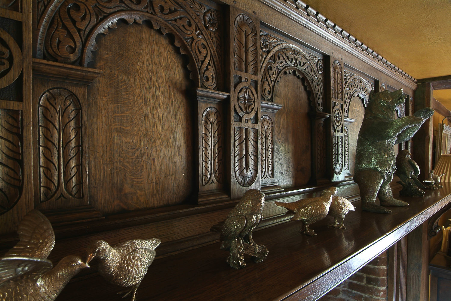 Solid oak Tudor style carved fire overmantel
