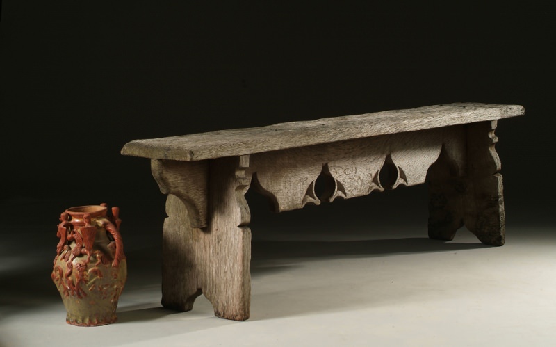Gothic style oak bench with a weathered finish