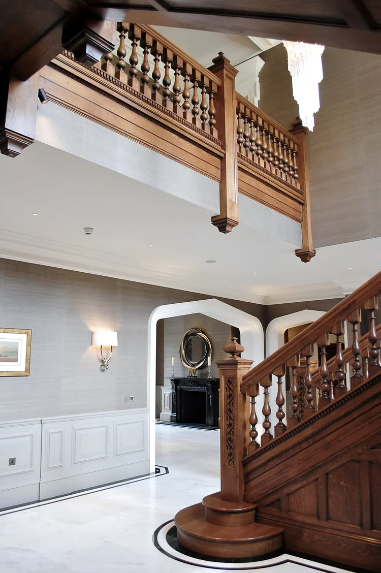 A period oak staircase with a bull nose tread and balustrade gallery.jpg