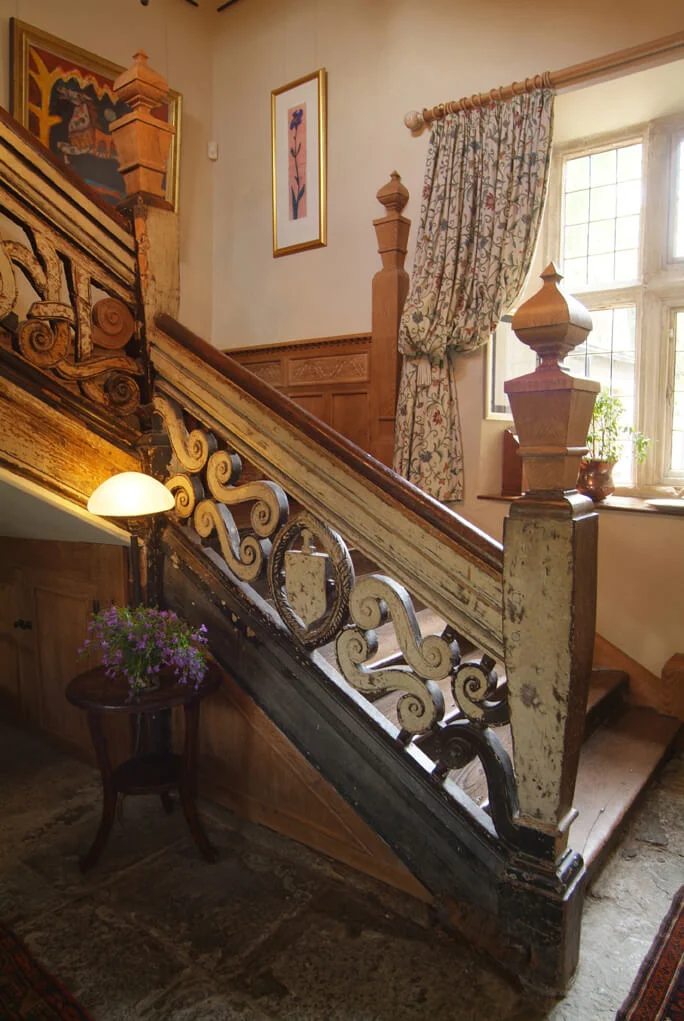 Oak and Elm staircase with heavily carved balustrade restored and conserved.jpg