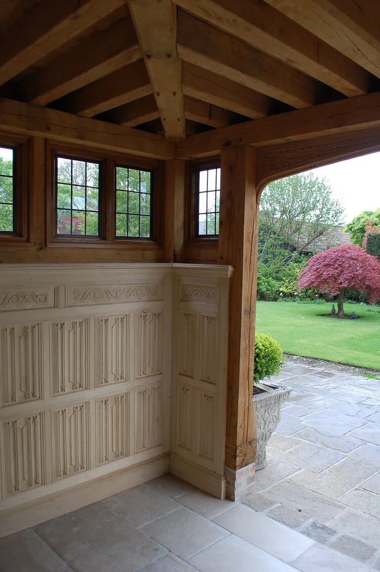 16th century style porch joinery with oak panelling and handcarved linenfold decoration.jpg