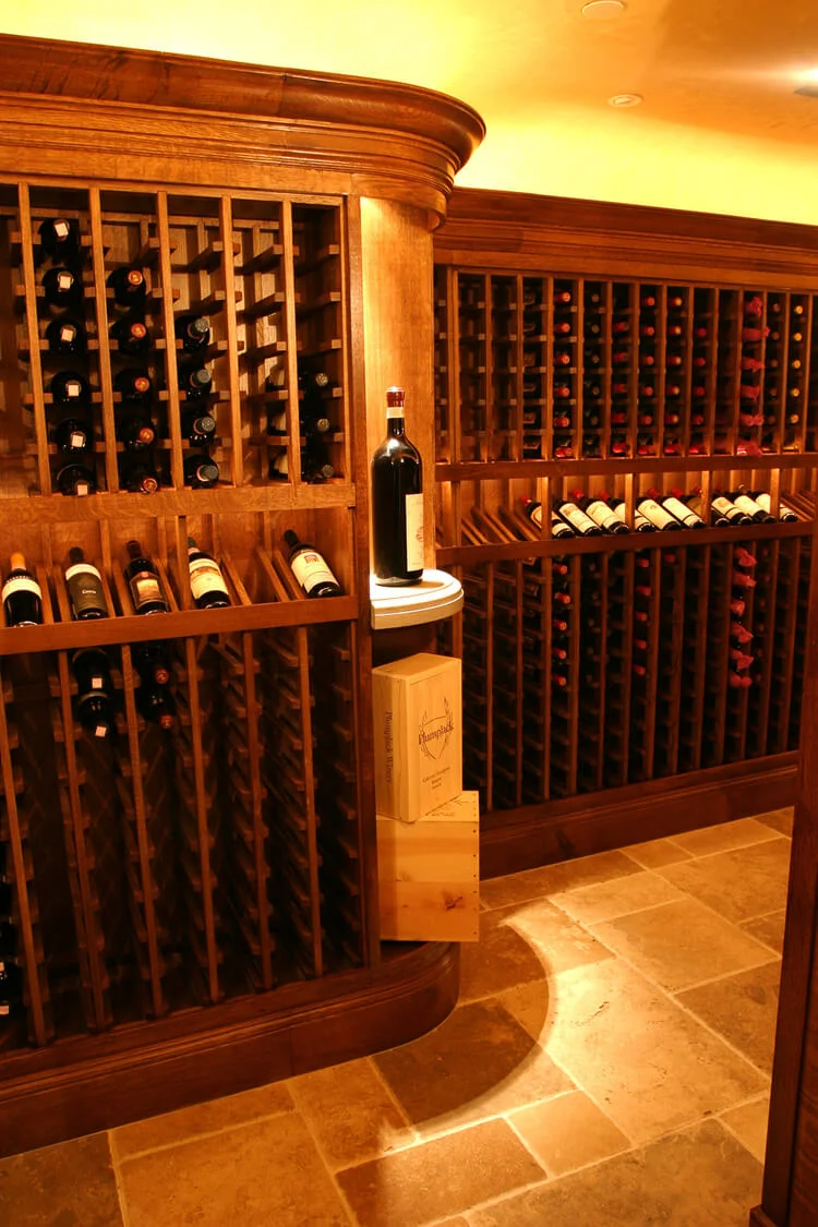 Curved cornice design in a bespoke oak wine cellar.jpg