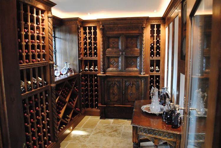 Wine room with oak wine racks and hand carved features.jpg