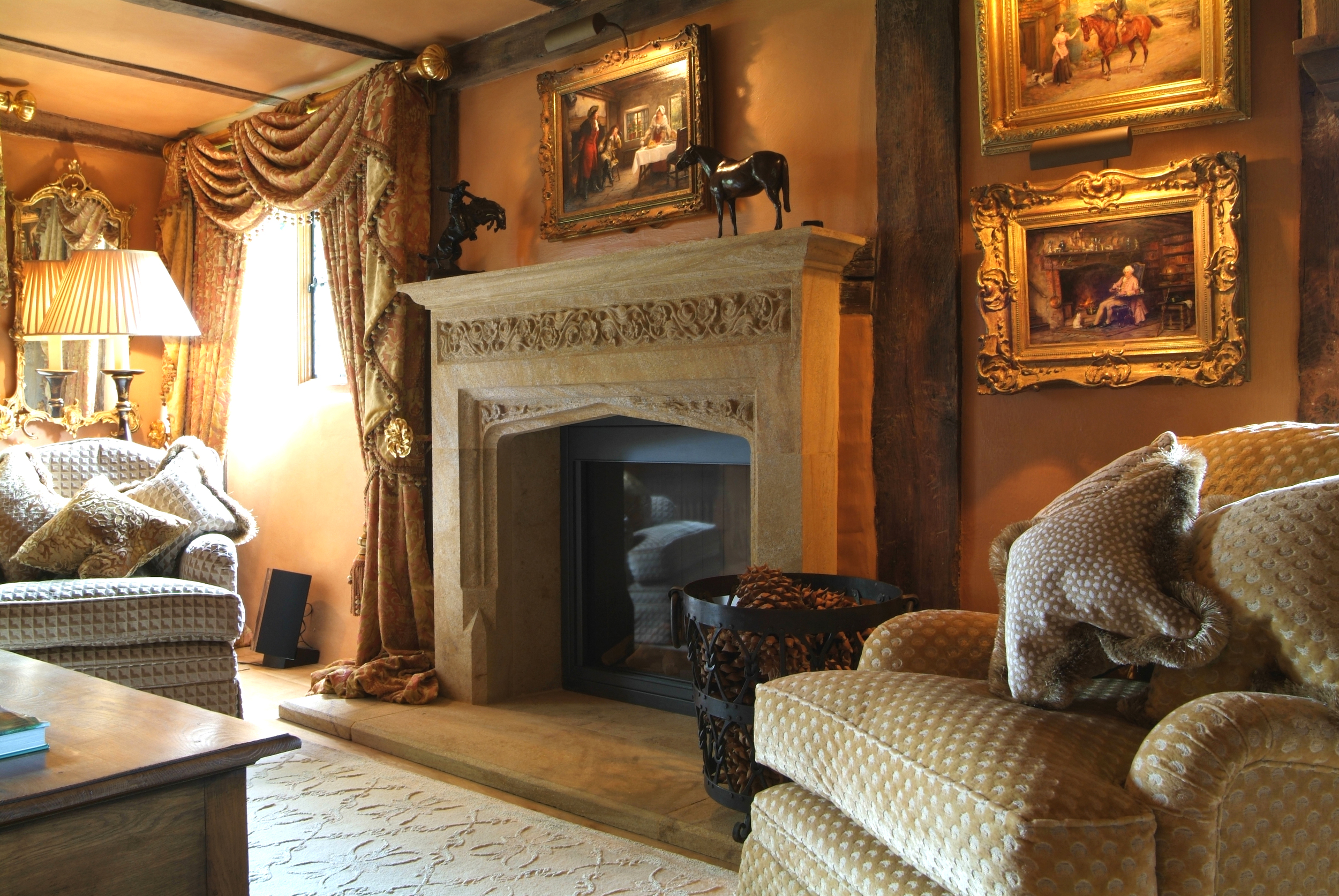 Carved hamstone fireplace with ornate frieze, installed in to a listed property