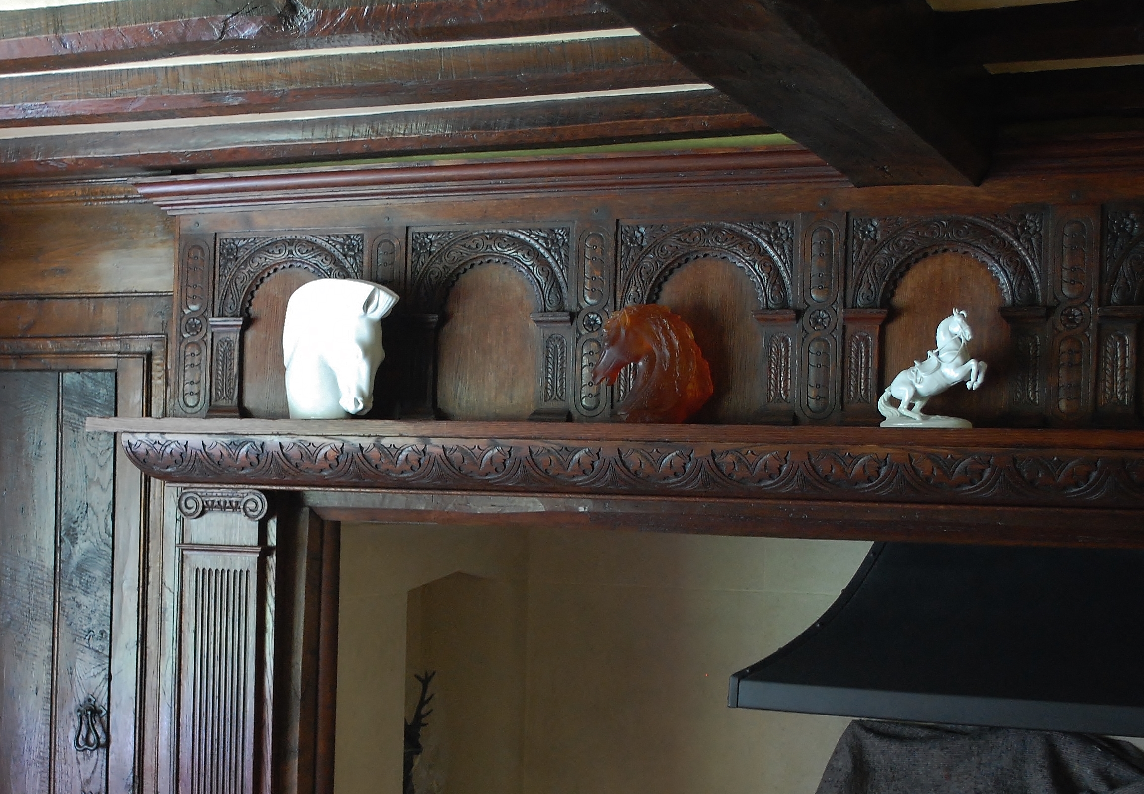 17th century style fire surround with carved arches