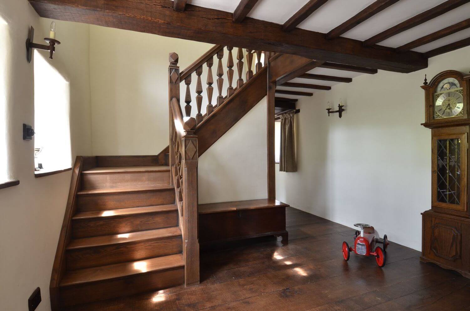 An early period 16th, 17th style century Staircase in antique oak. ABespoke designed staircase in a Jacobean style with hand made and cut finials carved newels and balusters staircase. 