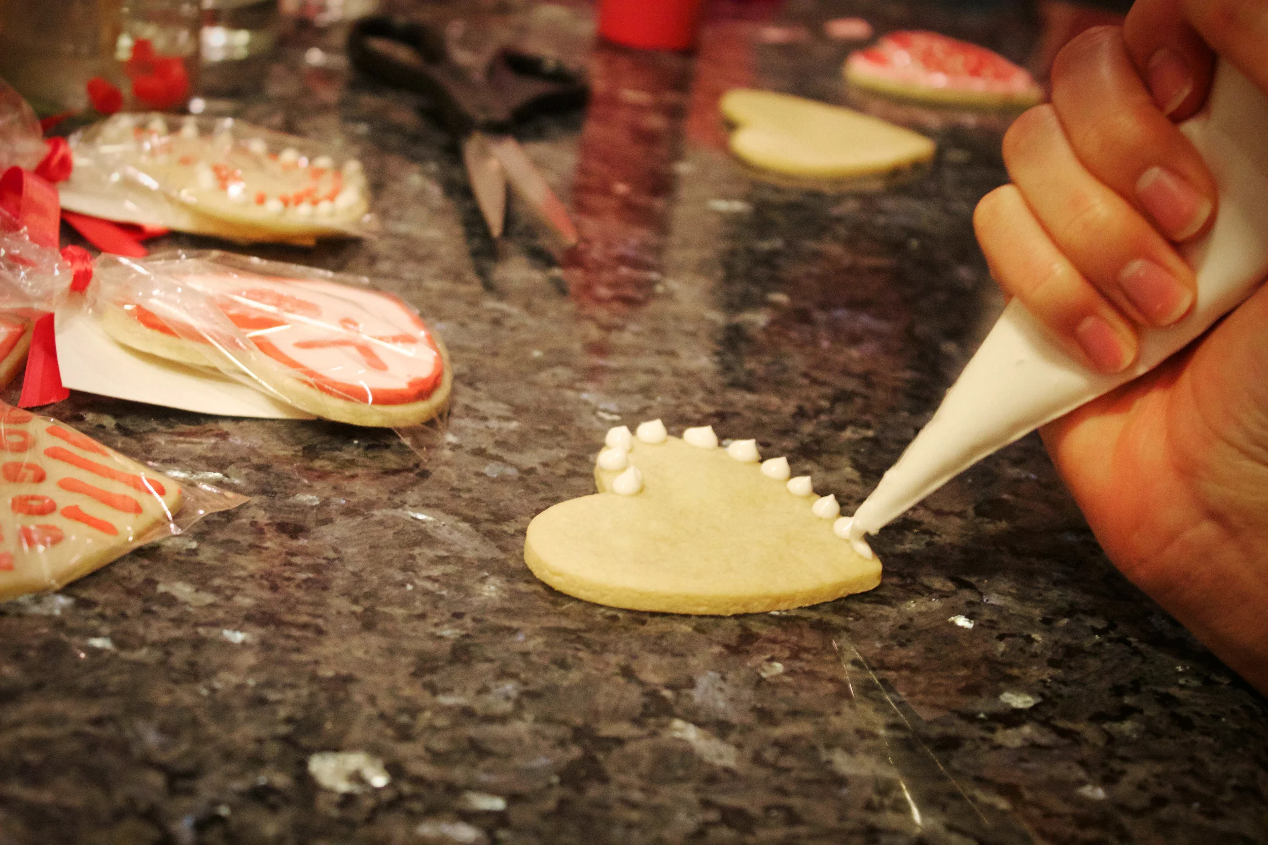 decorating heart cookie