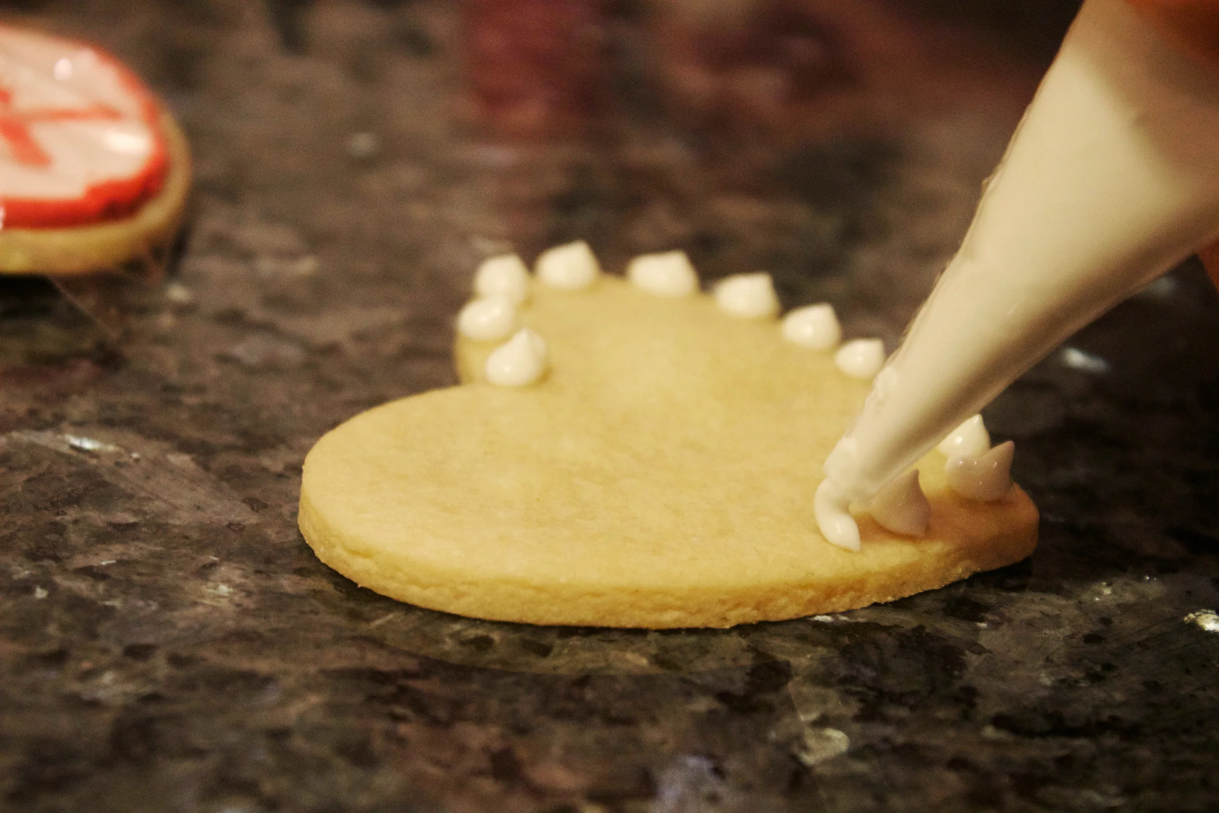 decorating heart shaped cookie