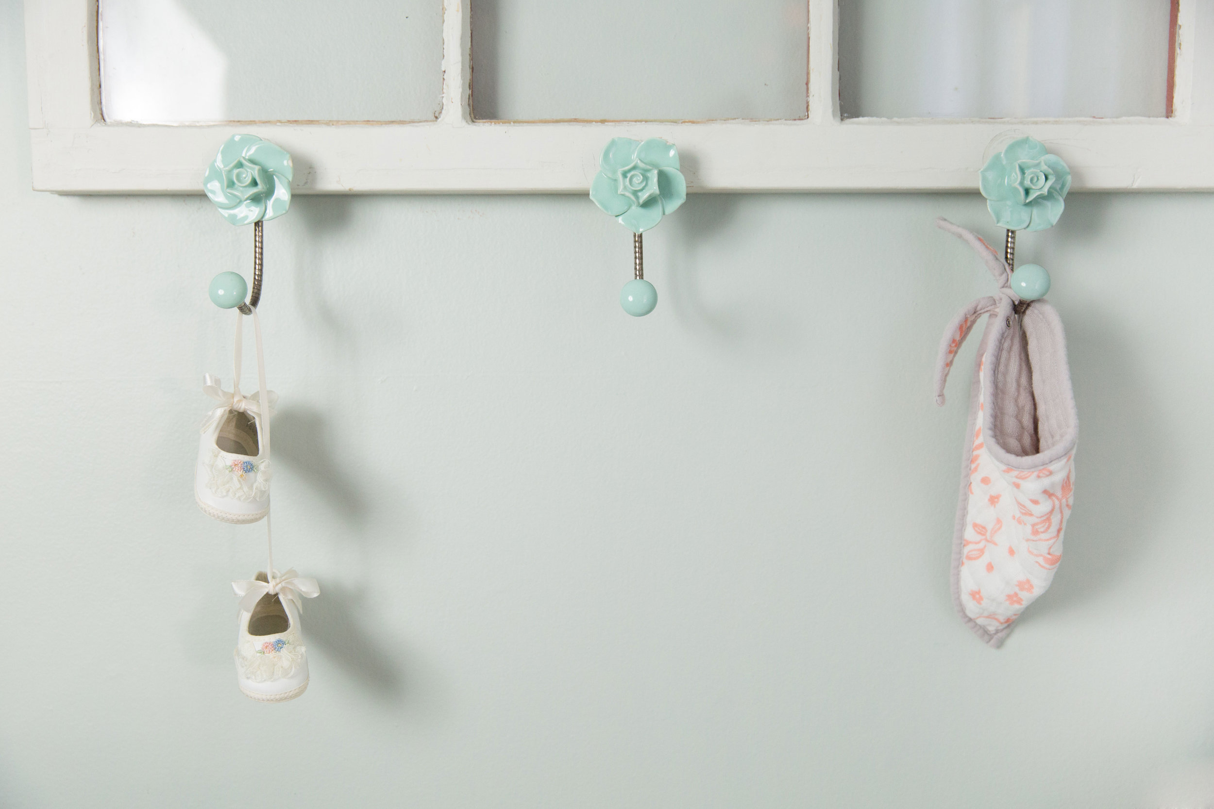 Baby Shoes Hanging in Nursery