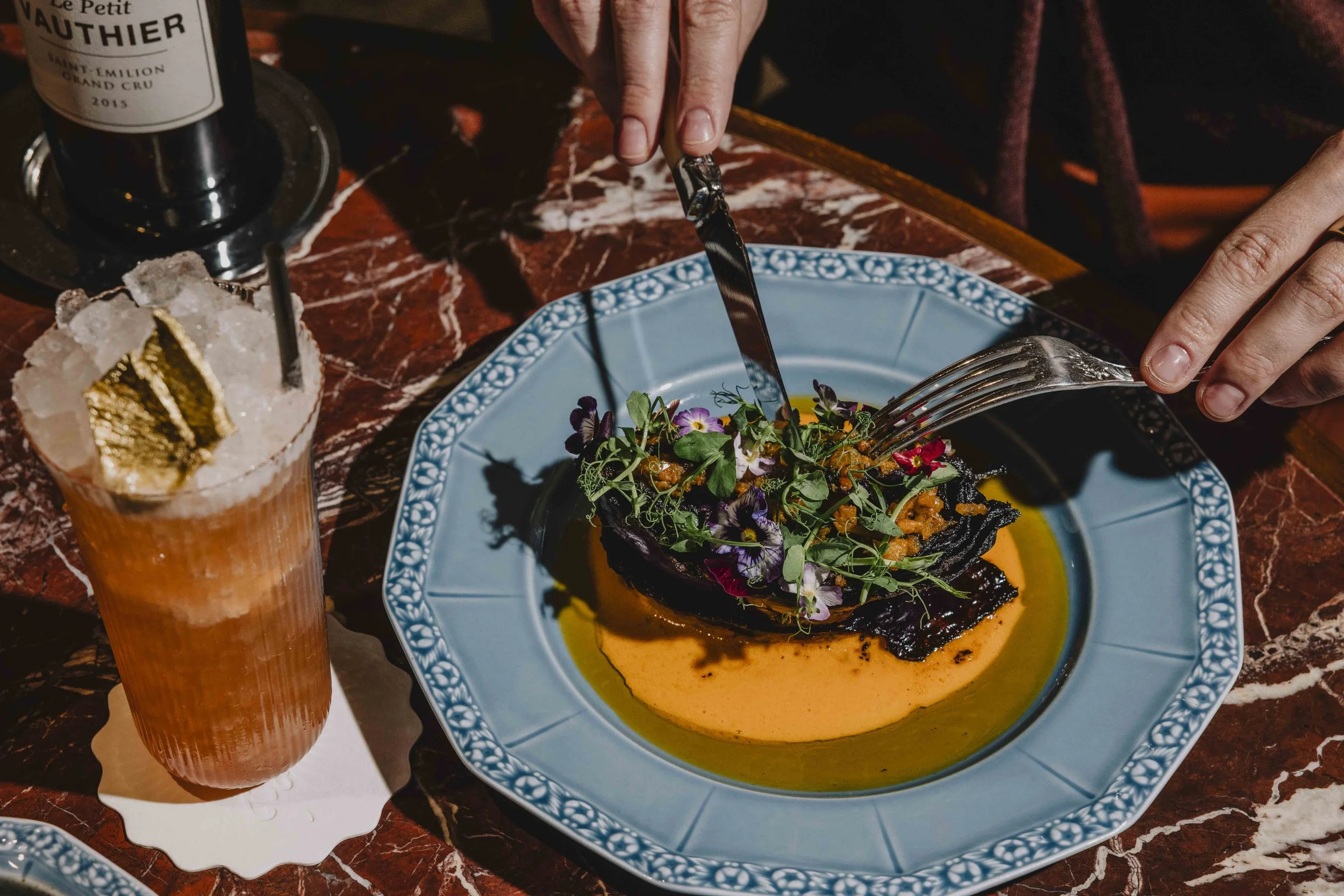 diner-cutting-into-eggplant.jpg