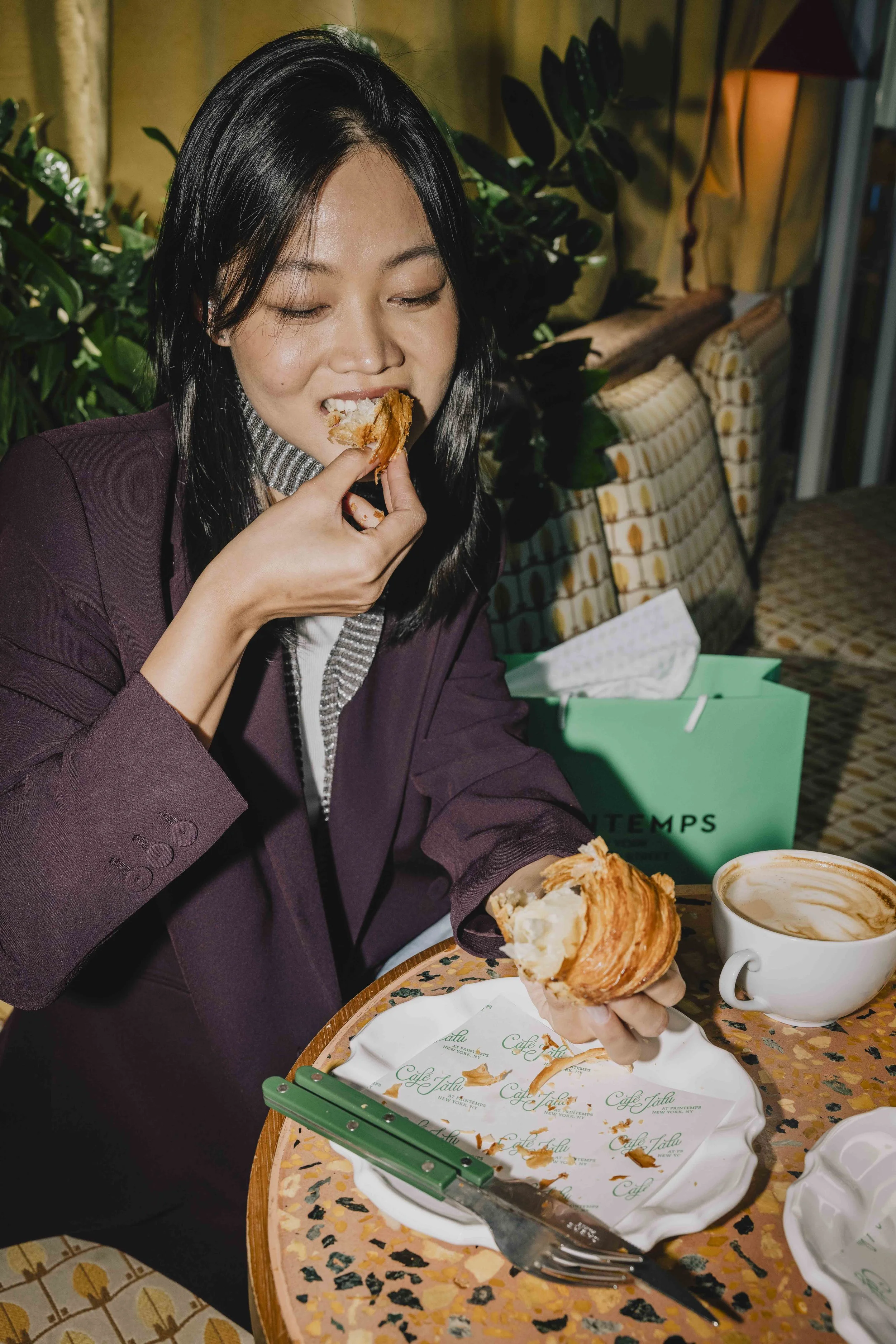 woman-eating-croissant.jpg
