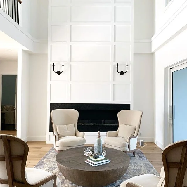 We have been seeing more and more clients just wanting white walls. We personally love it too. These gorgeous wide plank natural oak floors really pop. When you have a very neutral color palette, the furniture and little touches you use really stand 