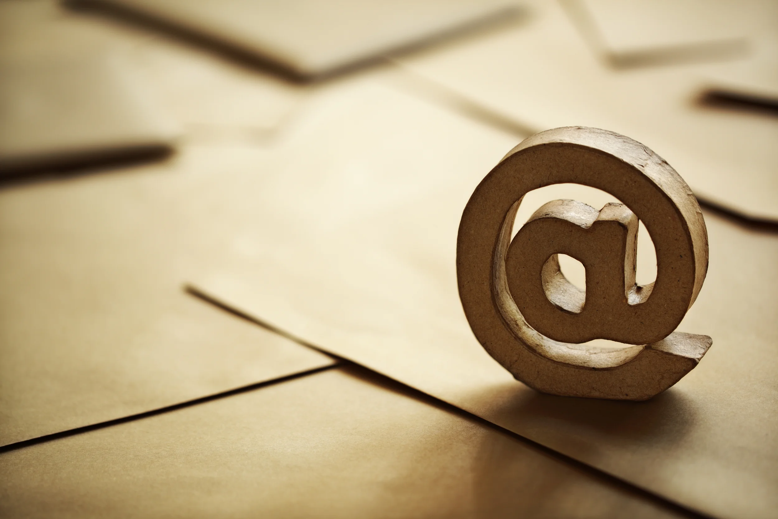 bigstock-E-mail-symbol-on-brown-busines-52524382.jpg